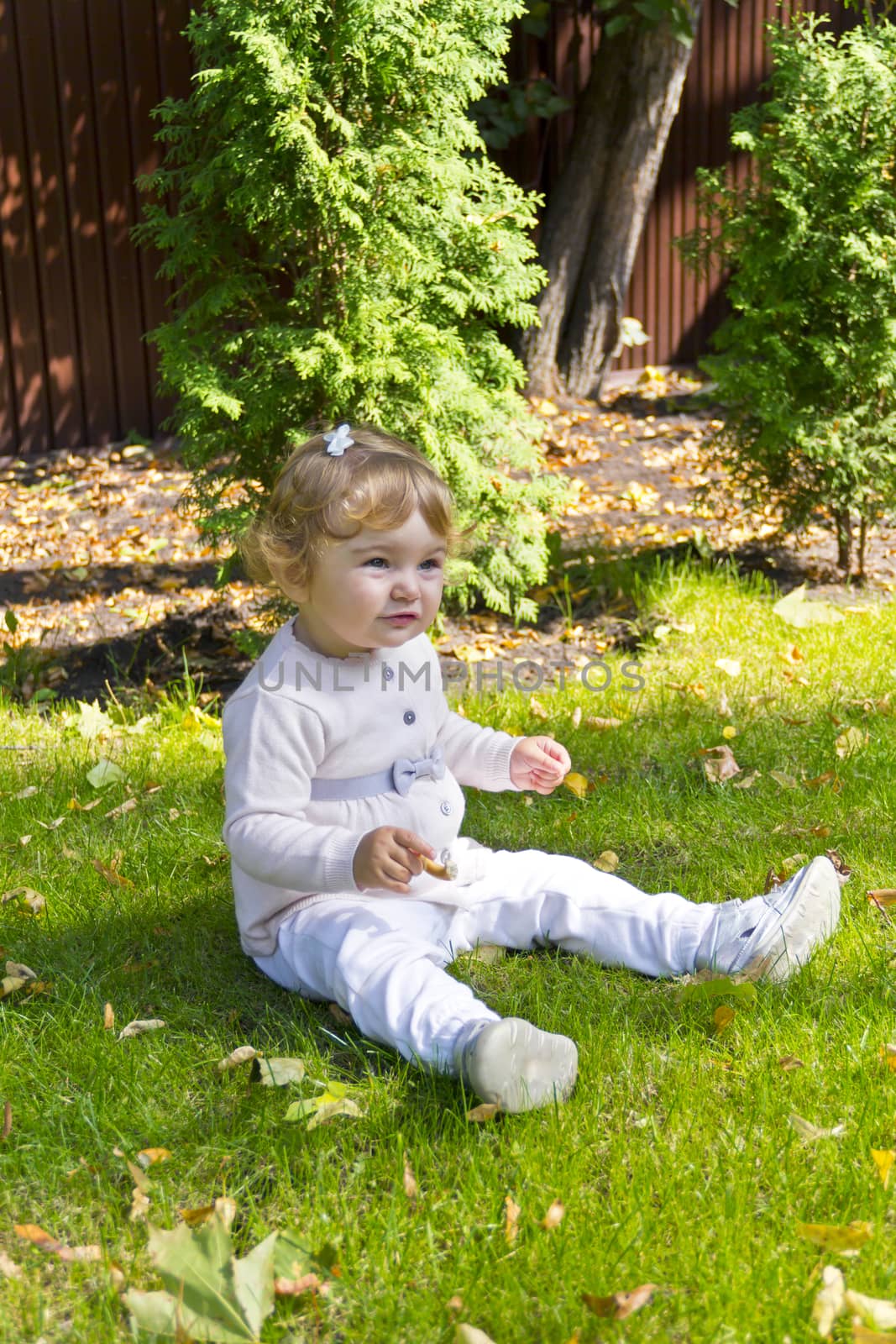 Caucasian beautiful cute infant girl in summer