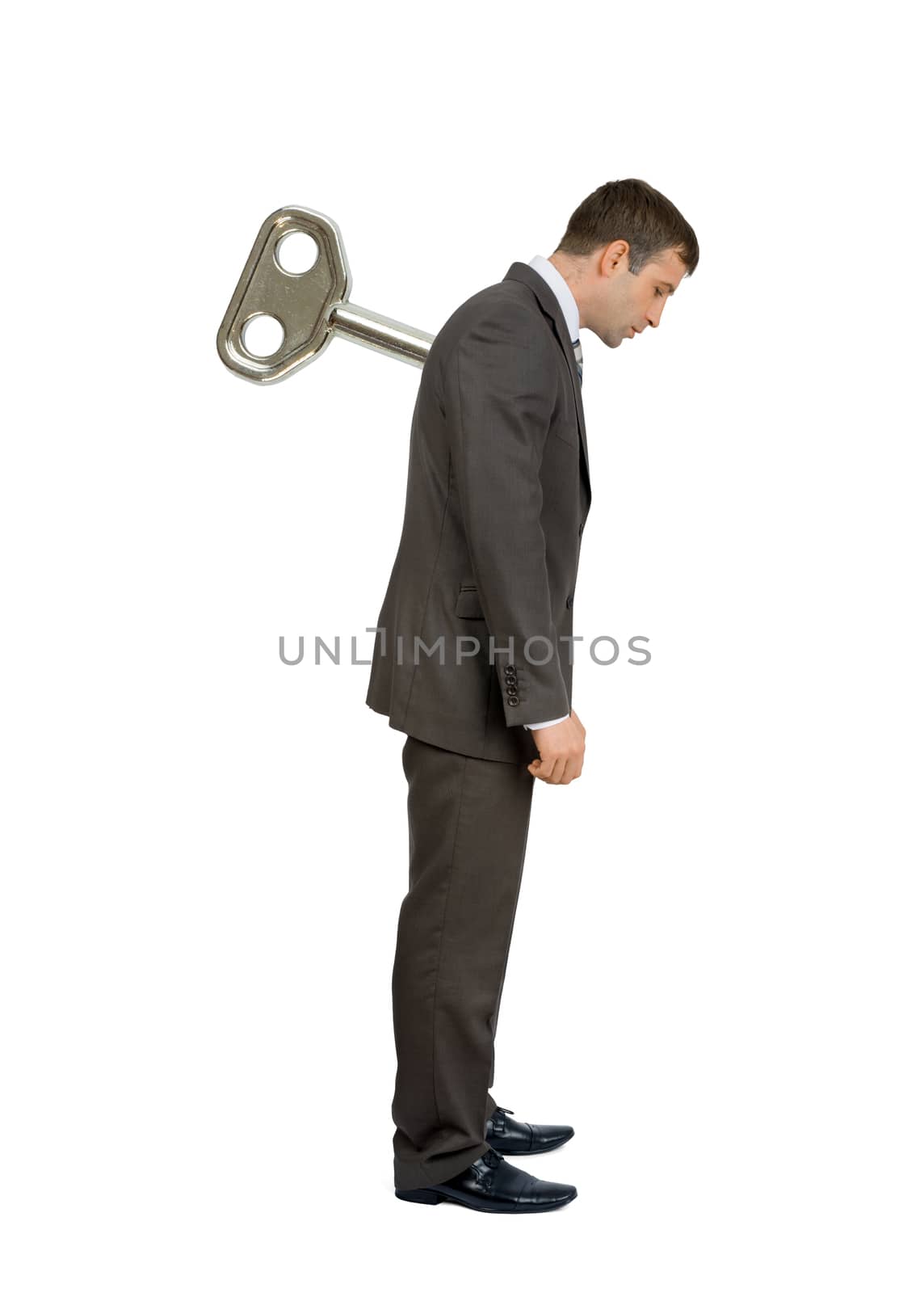 Businessman with key on back isolated on white background, manipulating concept