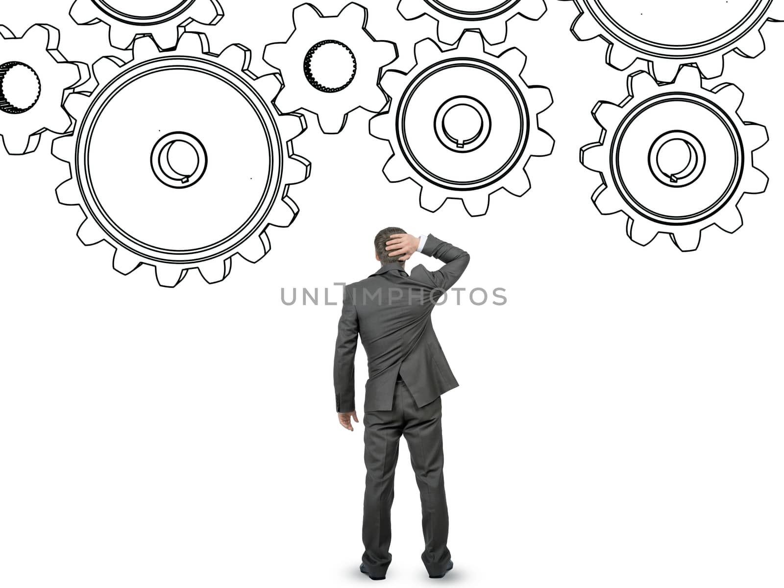 Confused businessman in front of cog wheels isolated on white background