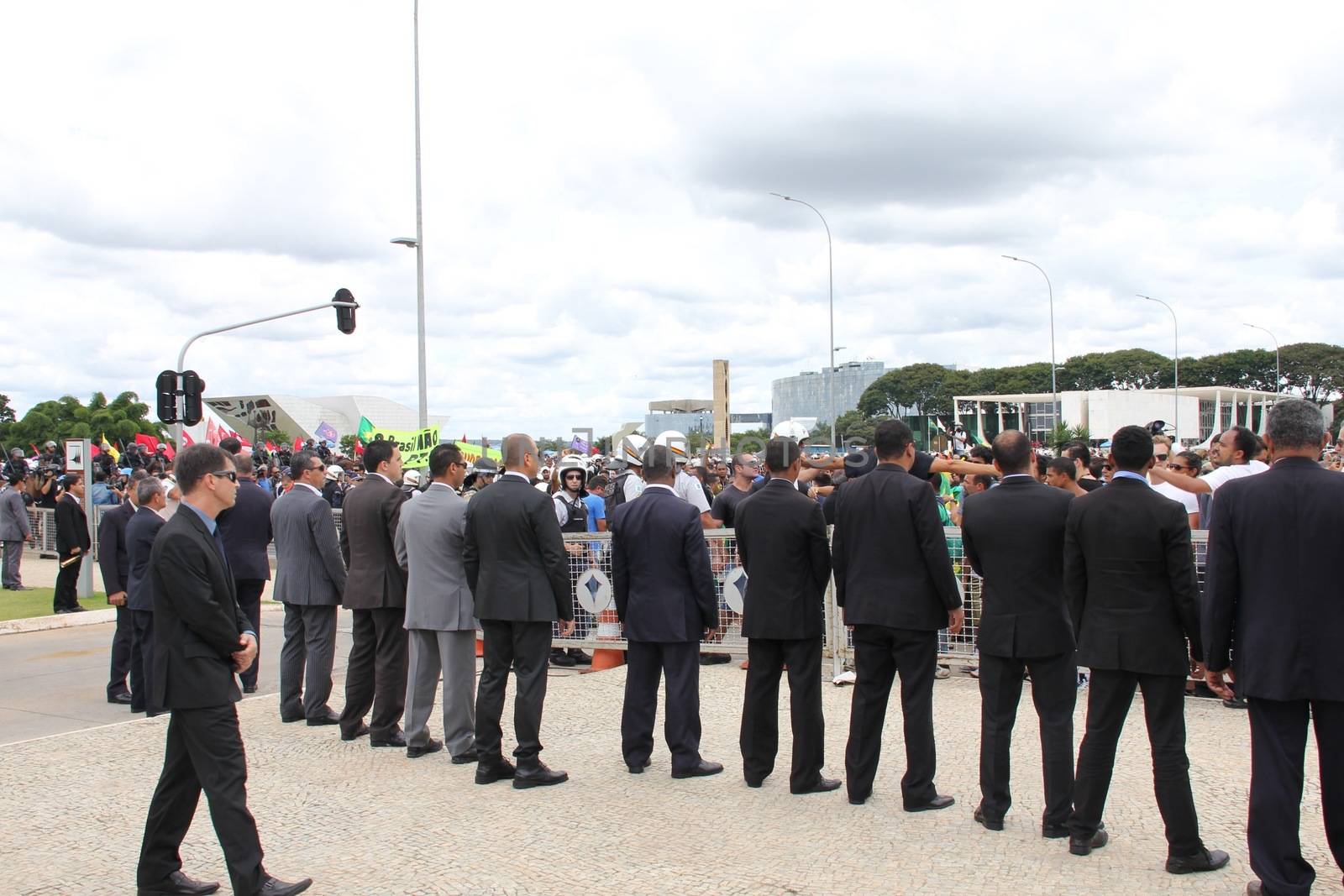 BRAZIL, Brasilia: Security officials stand in a line outside the Presidential Palace in Brasilia, Brazil on March 17, 2016 after ex-president Luiz Inácio Lula da Silva was appointed to the cabinet.The decision resulted in protests throughout the country, with some thinking that the appointment of the former president was an attempt to save him from charges in a corruption scandal.