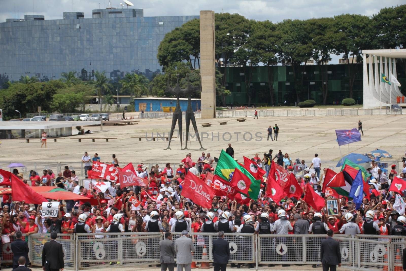 BRAZIL, Brasilia: Pro government supporters rally outside the Presidential Palace in Brasilia, Brazil on March 17, 2016 after ex-president Luiz Inácio Lula da Silva was appointed to the cabinet.The decision resulted in protests throughout the country, with some thinking that the appointment of the former president was an attempt to save him from charges in a corruption scandal.