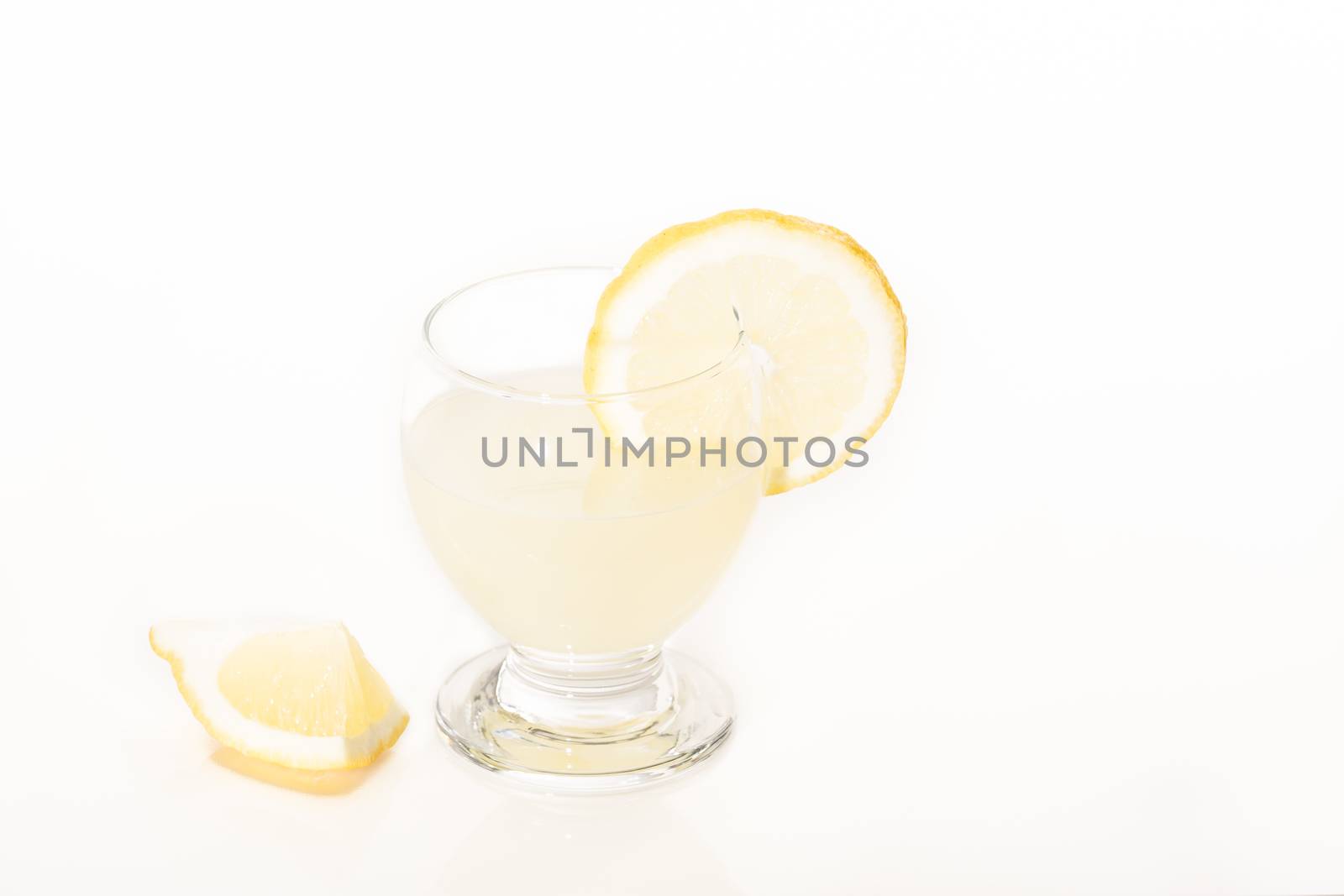 Detox glass of lemon juice, diet liver stomach on white background France