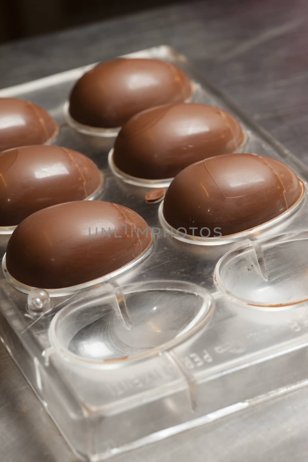 Ingredients and preparation of italian Easter milk and dark choccolate eggs and sweets