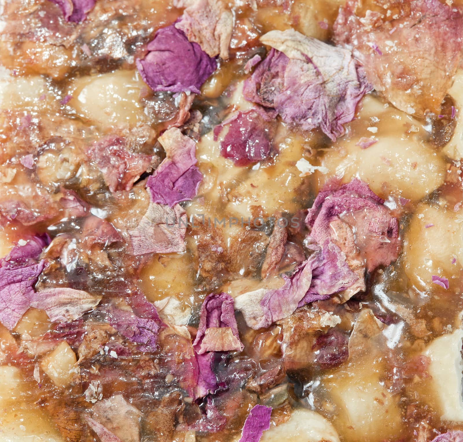 Indian sweet brittle with rose petals, close-up