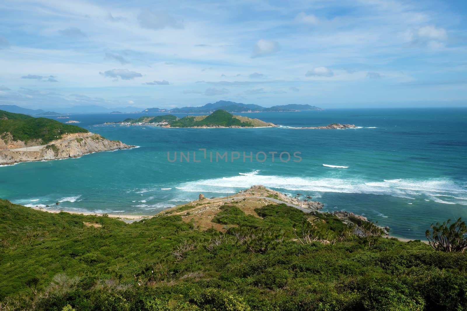 Beautiful panoramic landscape of Vietnam beach at Vinh Hy, Ninh Thuan, road along beach, small island, waves make, fresh air make fantastic holiday when travel at Viet Nam in summer or spring