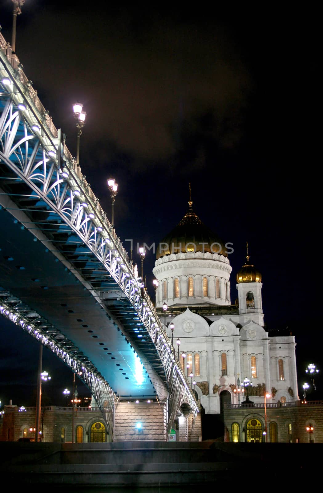 Night landscape the bridge through the Moskva River and the Cathedral of Christ the Saviour in the city of Moscow