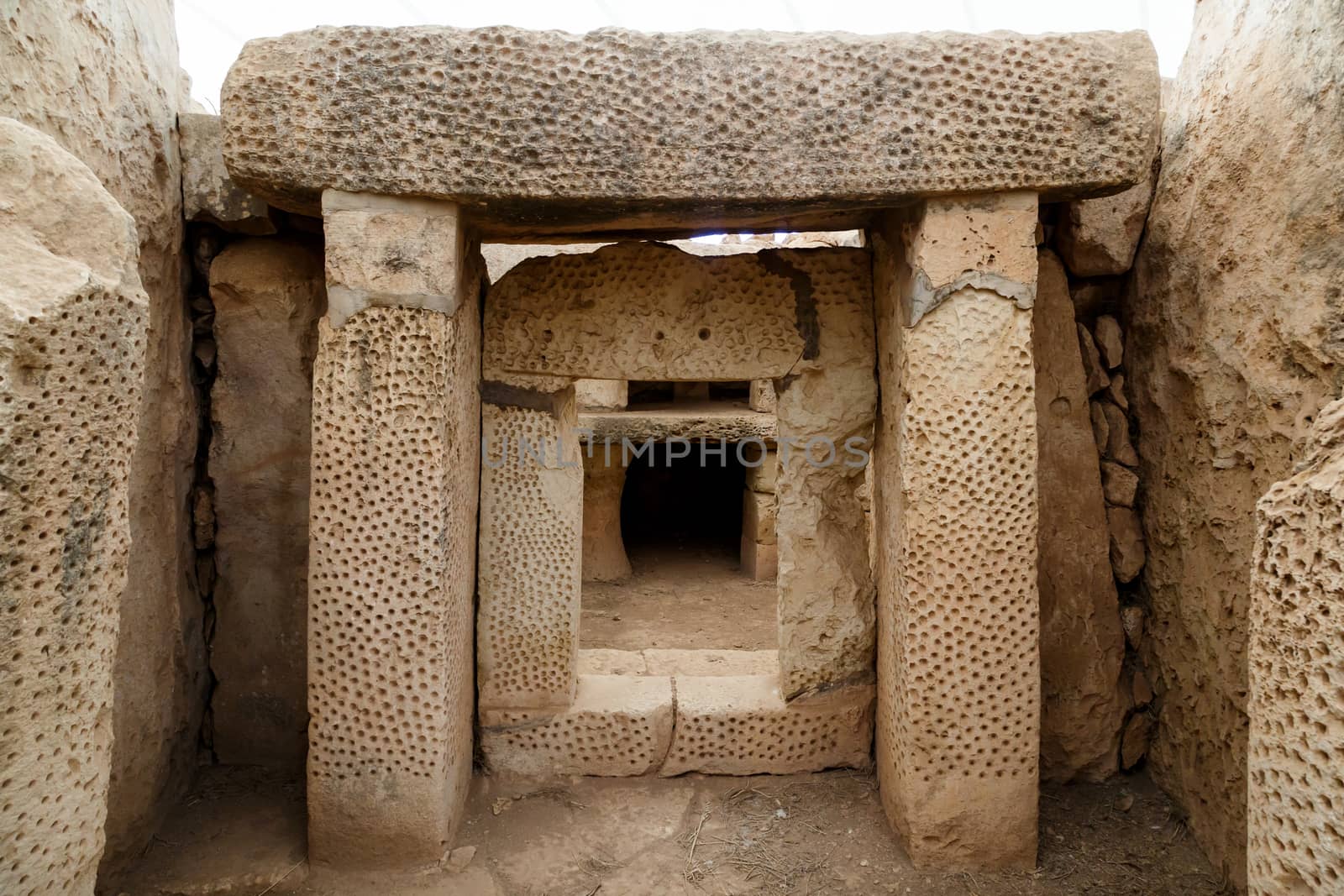 Door and window view of ancient limestone structures of Hagar Qim and Gnajdra Temples in Qrendi, Malta.