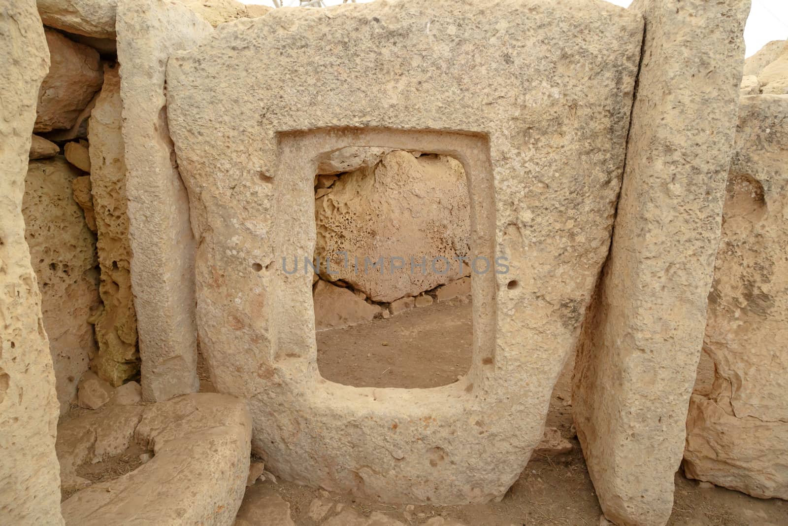 Door and window view of ancient limestone structures of Hagar Qim and Gnajdra Temples in Qrendi, Malta.