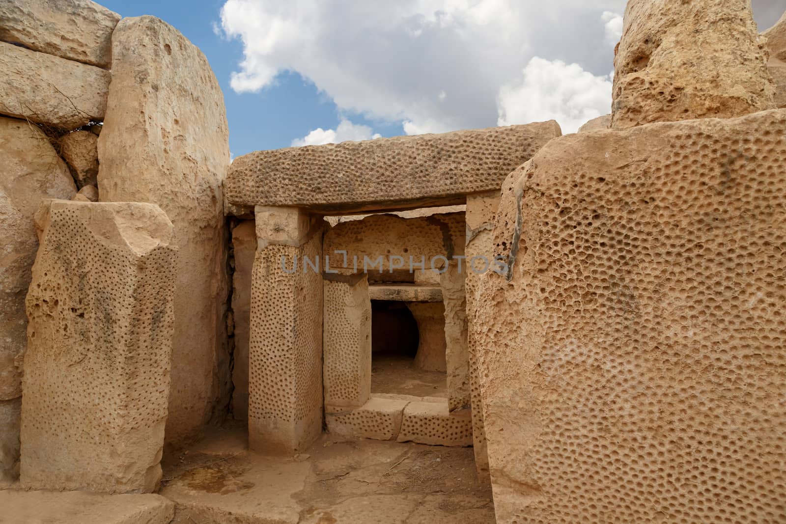Door and window view of ancient limestone structures of Hagar Qim and Gnajdra Temples in Qrendi, Malta.