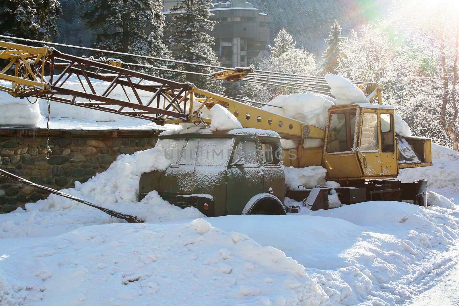 The truck crane under snow by Vadimdem