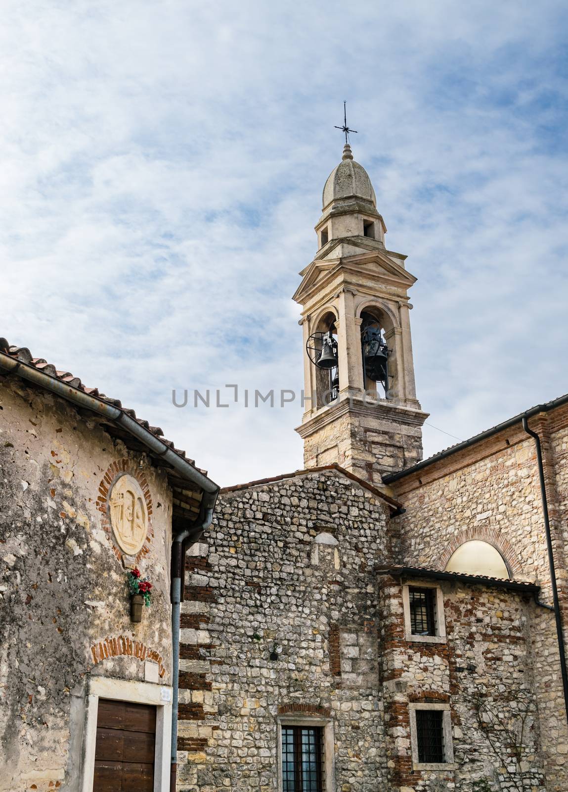 Bell tower of the medieval sanctuary of St. Mery of "Bassanella" in Soave, Italy.