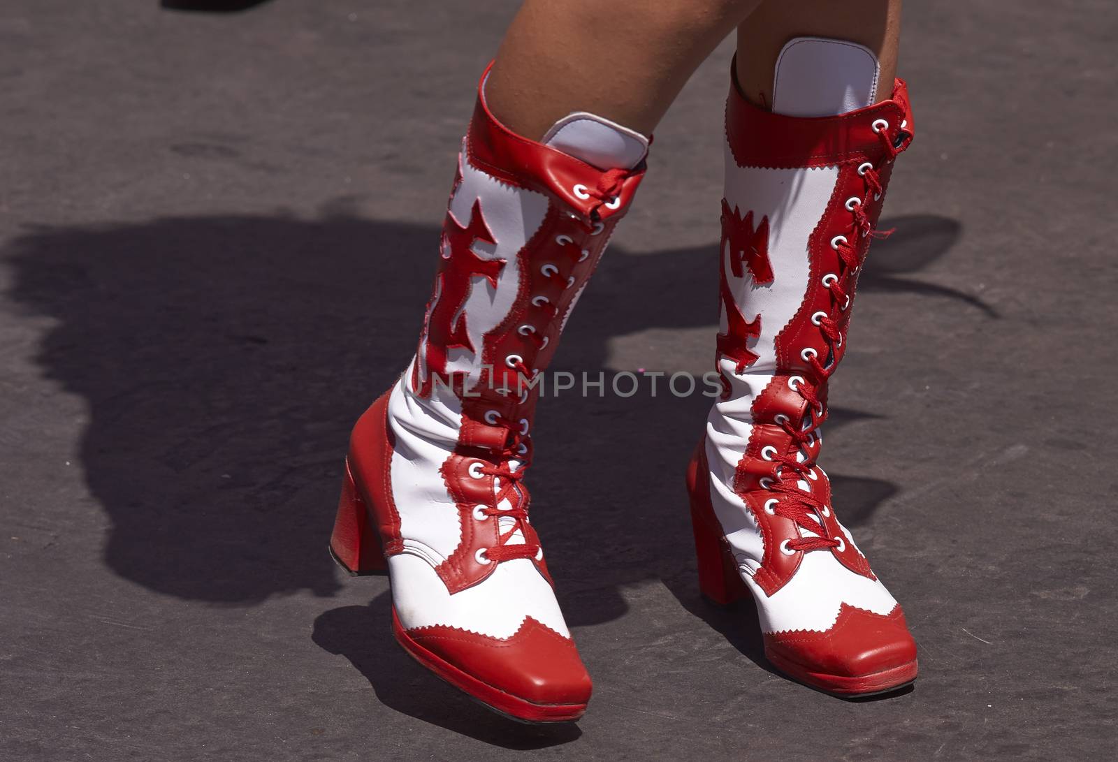 Colourful boots worn by a female member of a Morenada dance group performing as part of the Carnaval Andino con la Fuerza del Sol in Arica, Chile.