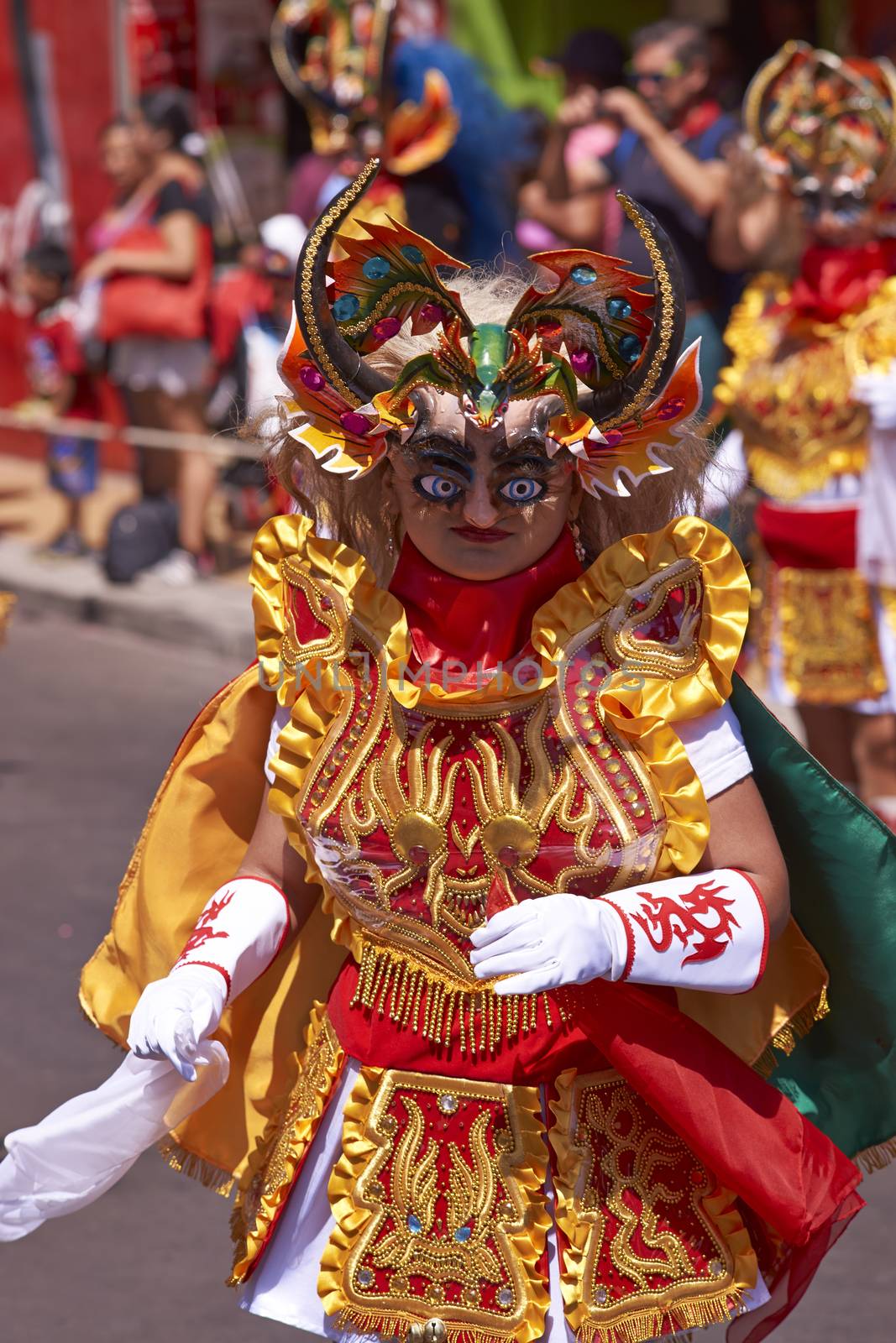 Masked man performing the Diablada (dance of the devil) as part of the Carnaval Andino con la Fuerza del Sol in Arica, Chile. The dance originates in Oruro, Bolivia.