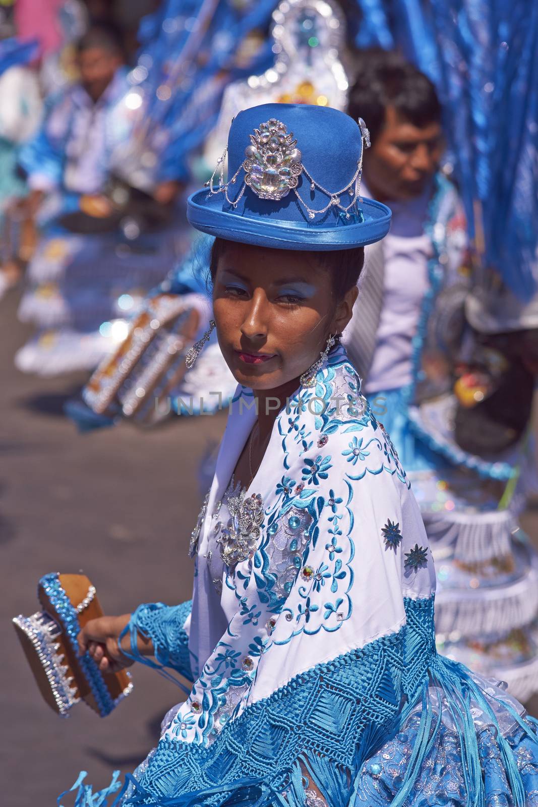 Female dancer in a Morenada dance group performing a traditional ritual dance as part of the Carnaval Andino con la Fuerza del Sol in Arica, Chile.