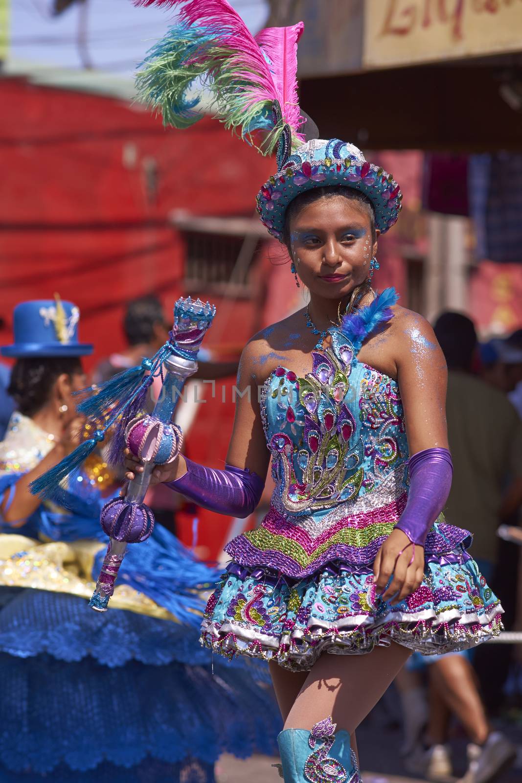 Female dancer in a Morenada dance group performing a traditional ritual dance as part of the Carnaval Andino con la Fuerza del Sol in Arica, Chile.