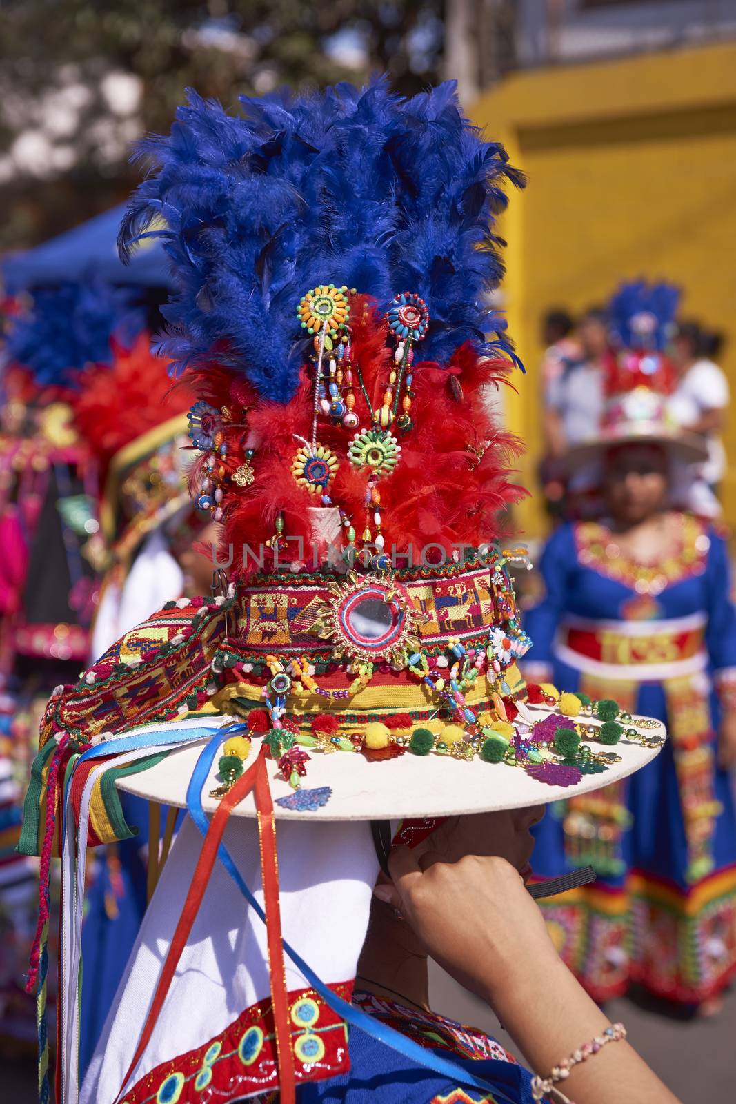 Detail of the ornate hat worn by a member of a Tinku group performing a traditional ritual dance as part of the Carnaval Andino con la Fuerza del Sol in Arica, Chile.