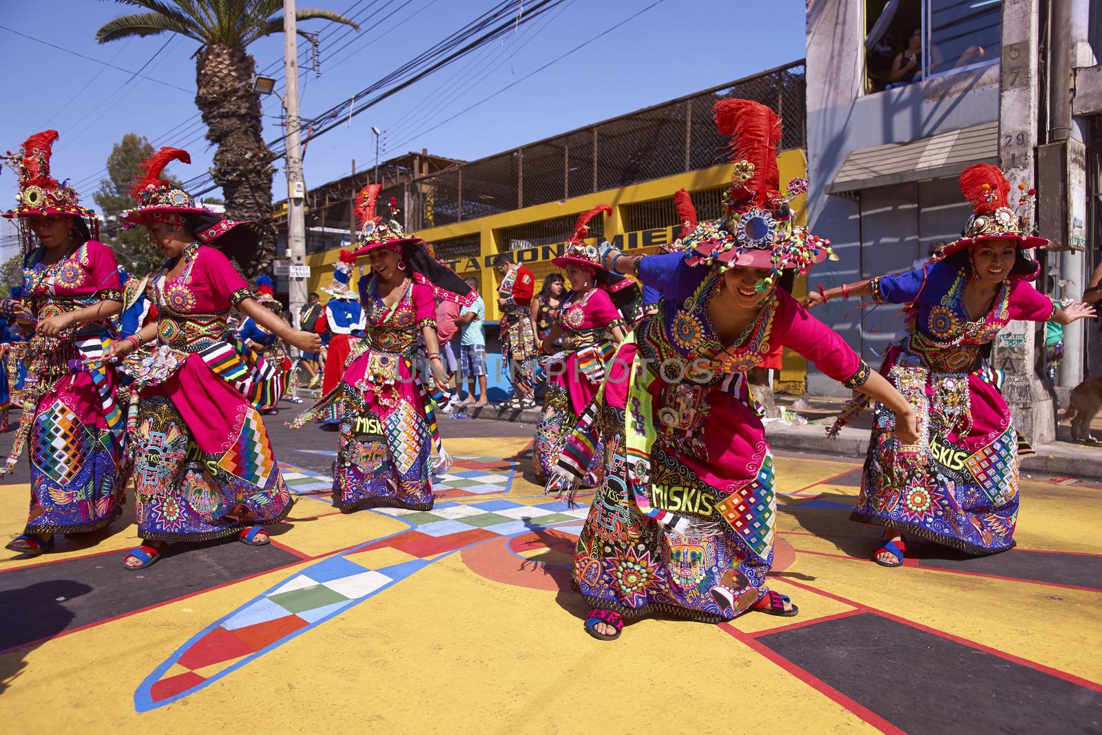 Tinku dancing group in colourful costumes performing a traditional ritual dance as part of the Carnaval Andino con la Fuerza del Sol in Arica, Chile.