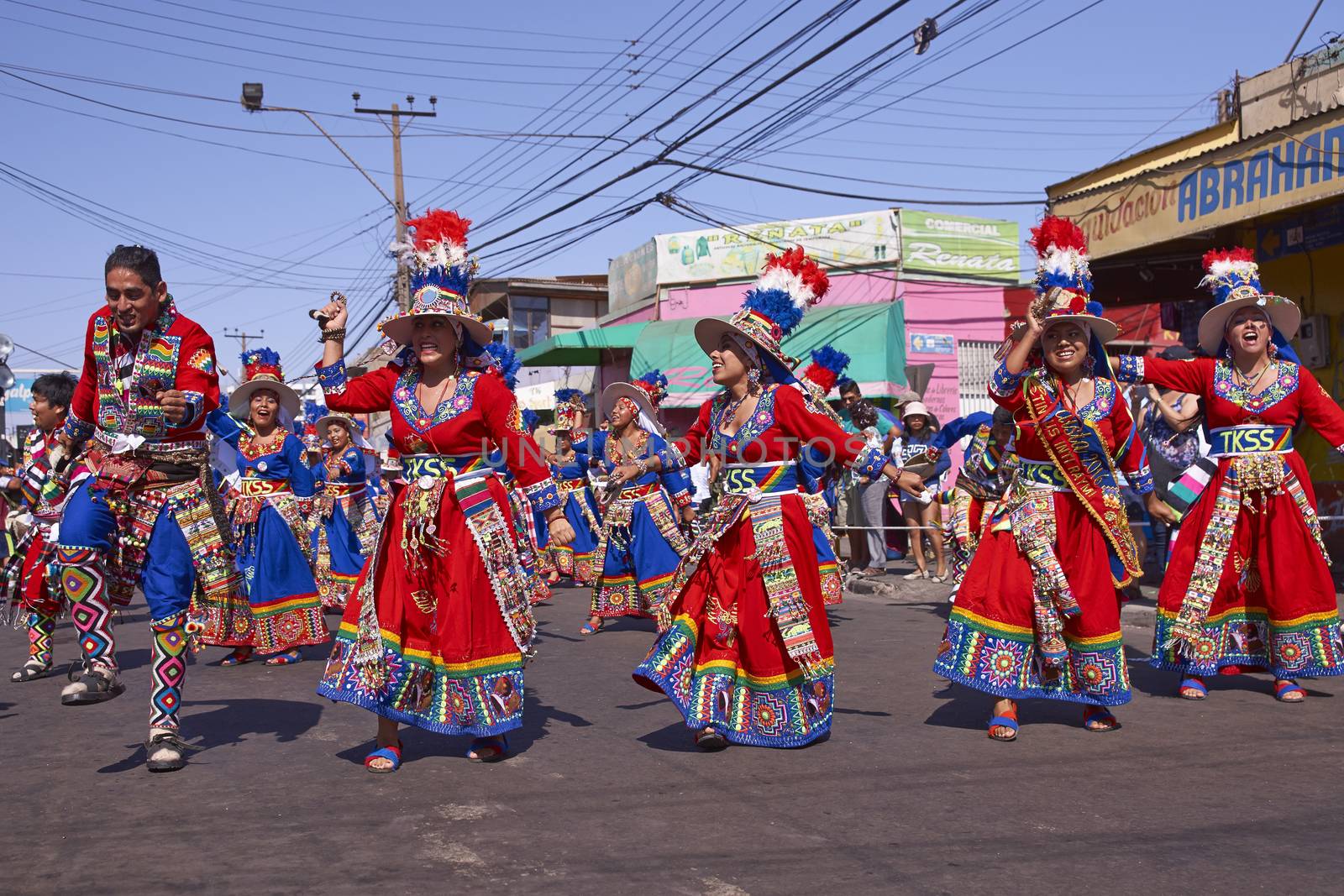 Tinku dancing group in colourful costumes performing a traditional ritual dance as part of the Carnaval Andino con la Fuerza del Sol in Arica, Chile.