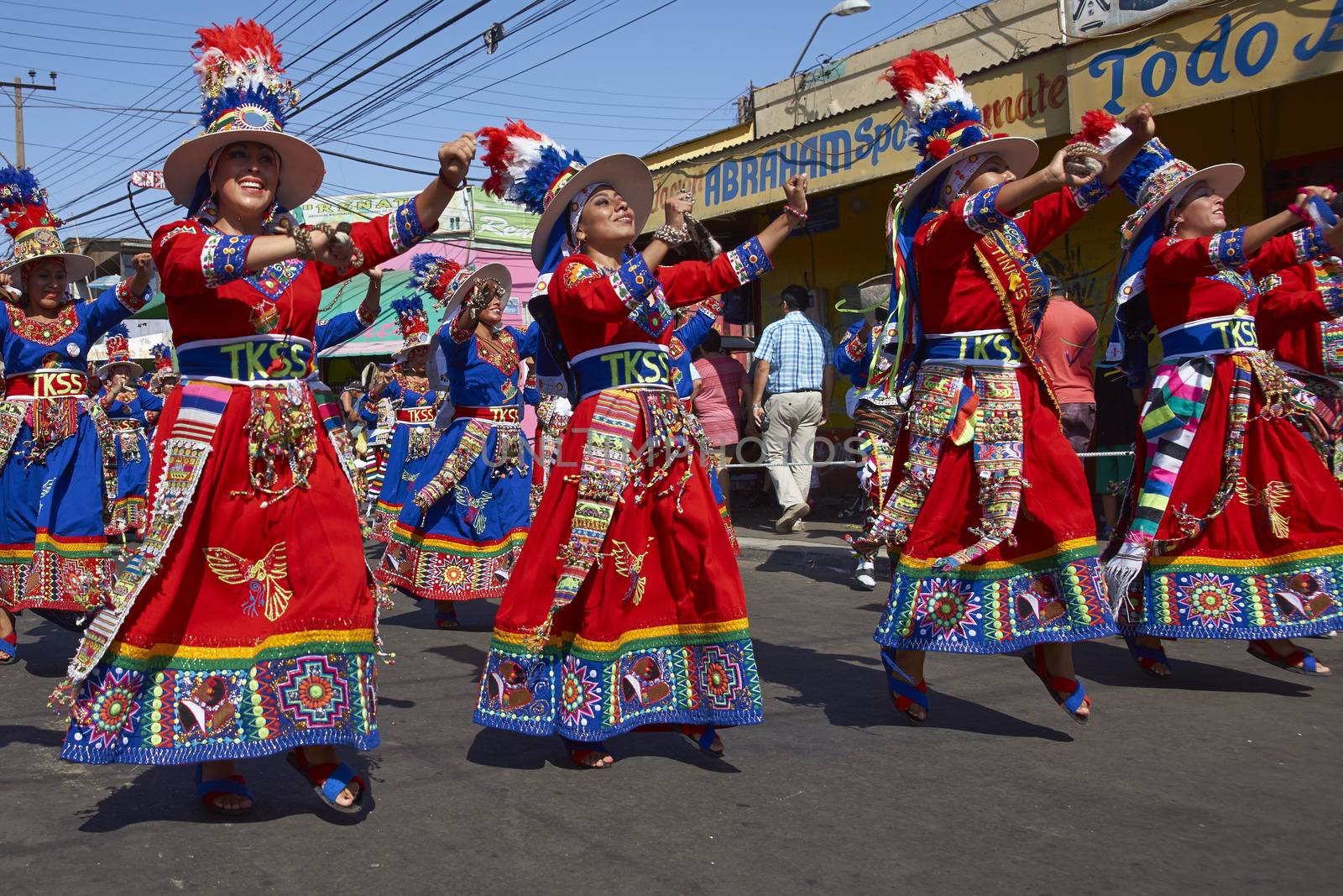 Tinku dancing group in colourful costumes performing a traditional ritual dance as part of the Carnaval Andino con la Fuerza del Sol in Arica, Chile.