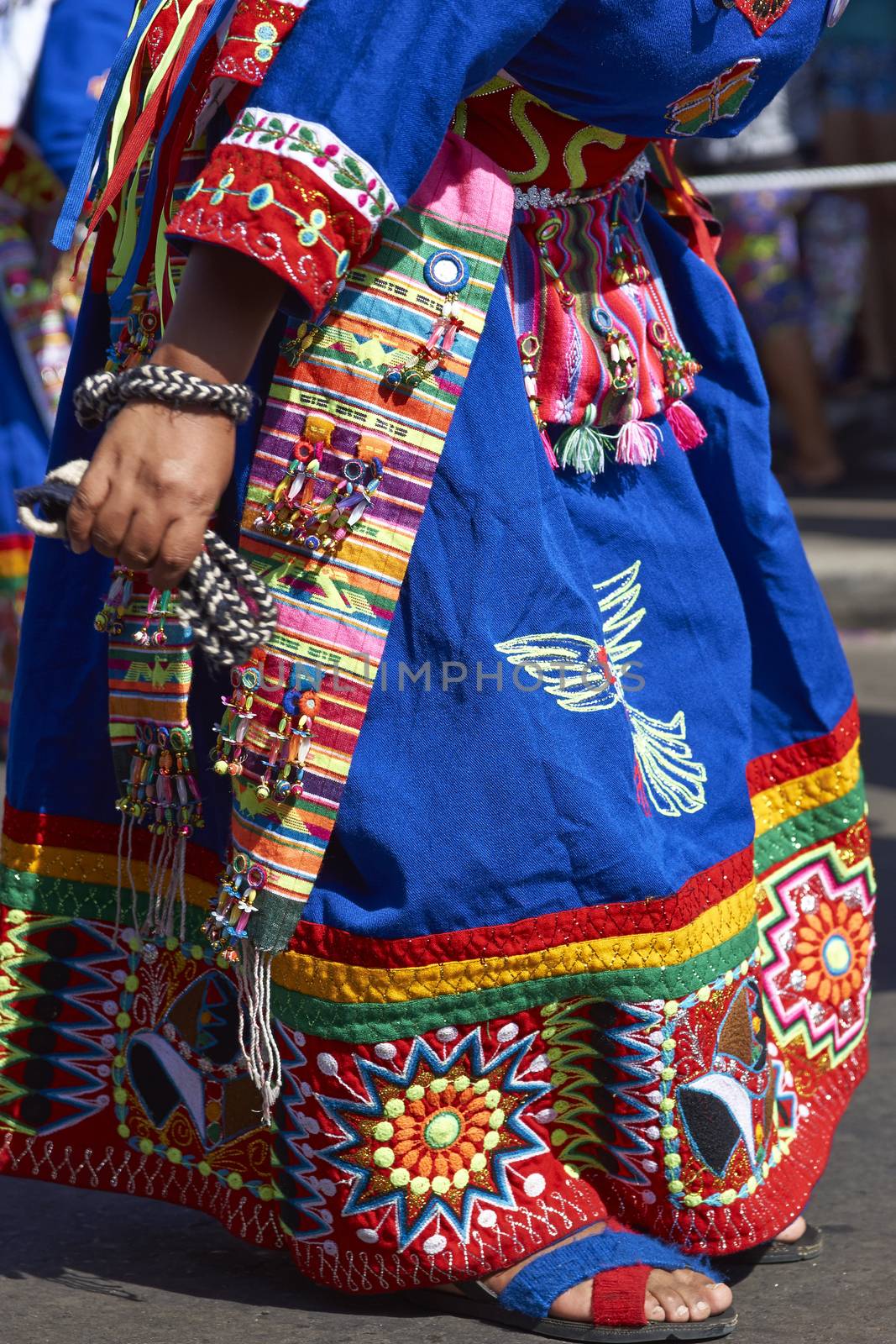 Detail of colourful costume worn by Tinku dancers performing a traditional ritual dance as part of the Carnaval Andino con la Fuerza del Sol in Arica, Chile.