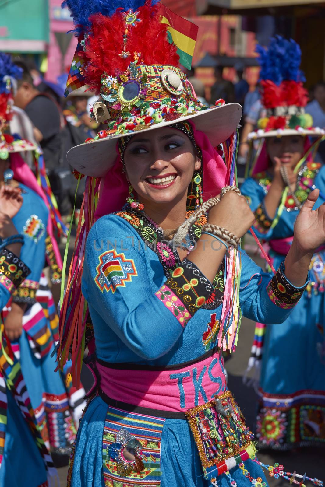 Tinku dancing group in colourful costumes performing a traditional ritual dance as part of the Carnaval Andino con la Fuerza del Sol in Arica, Chile.