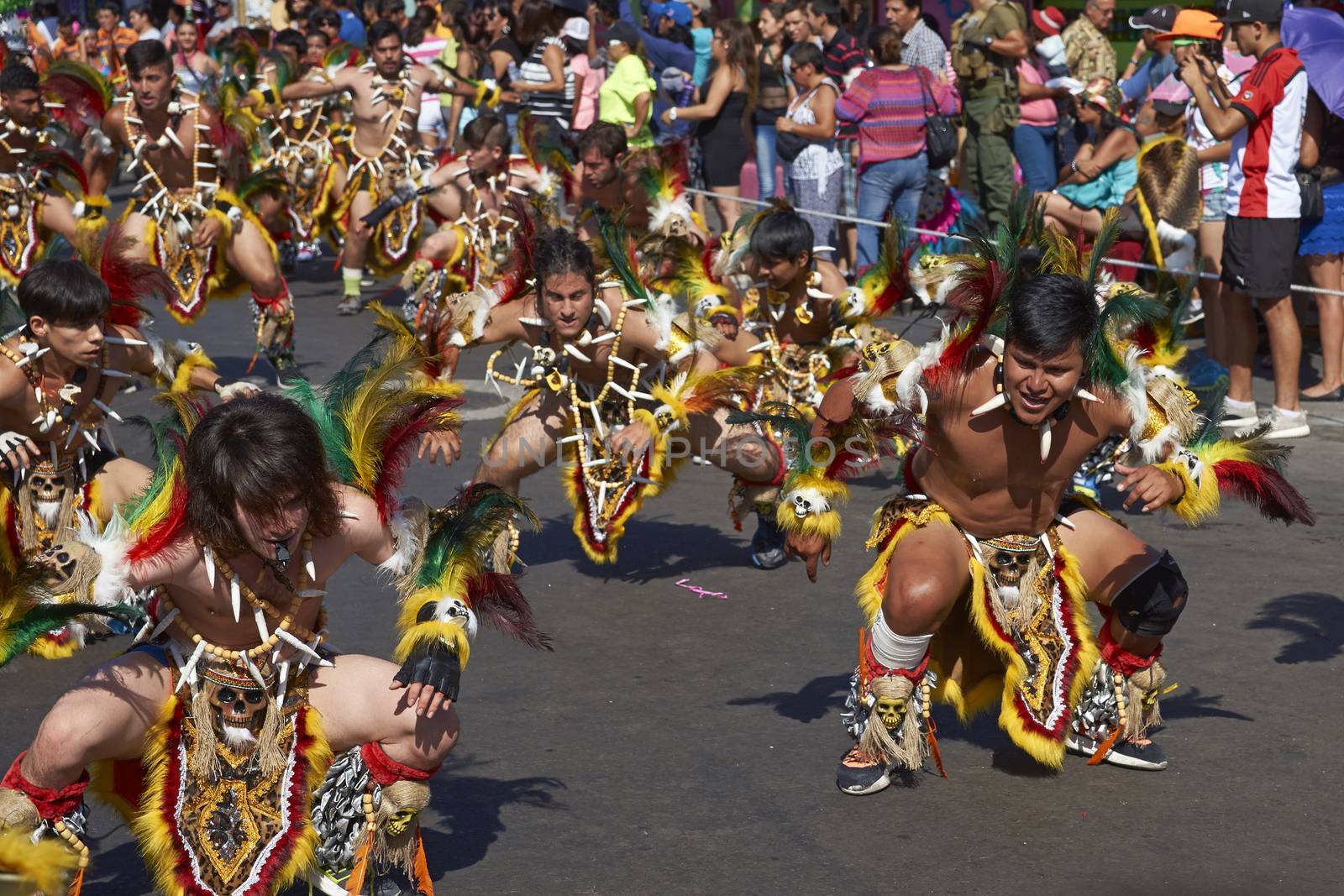 Group of men performing in a Tobas dance group at the Carnaval Andino con la Fuerza del Sol in Arica, Chile. The dance originates in Oruro, Bolivia.