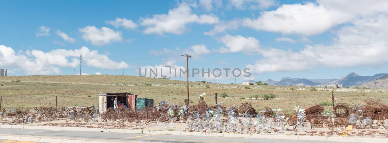 Wire-craft entrepreneurs selling windmills and other crafts