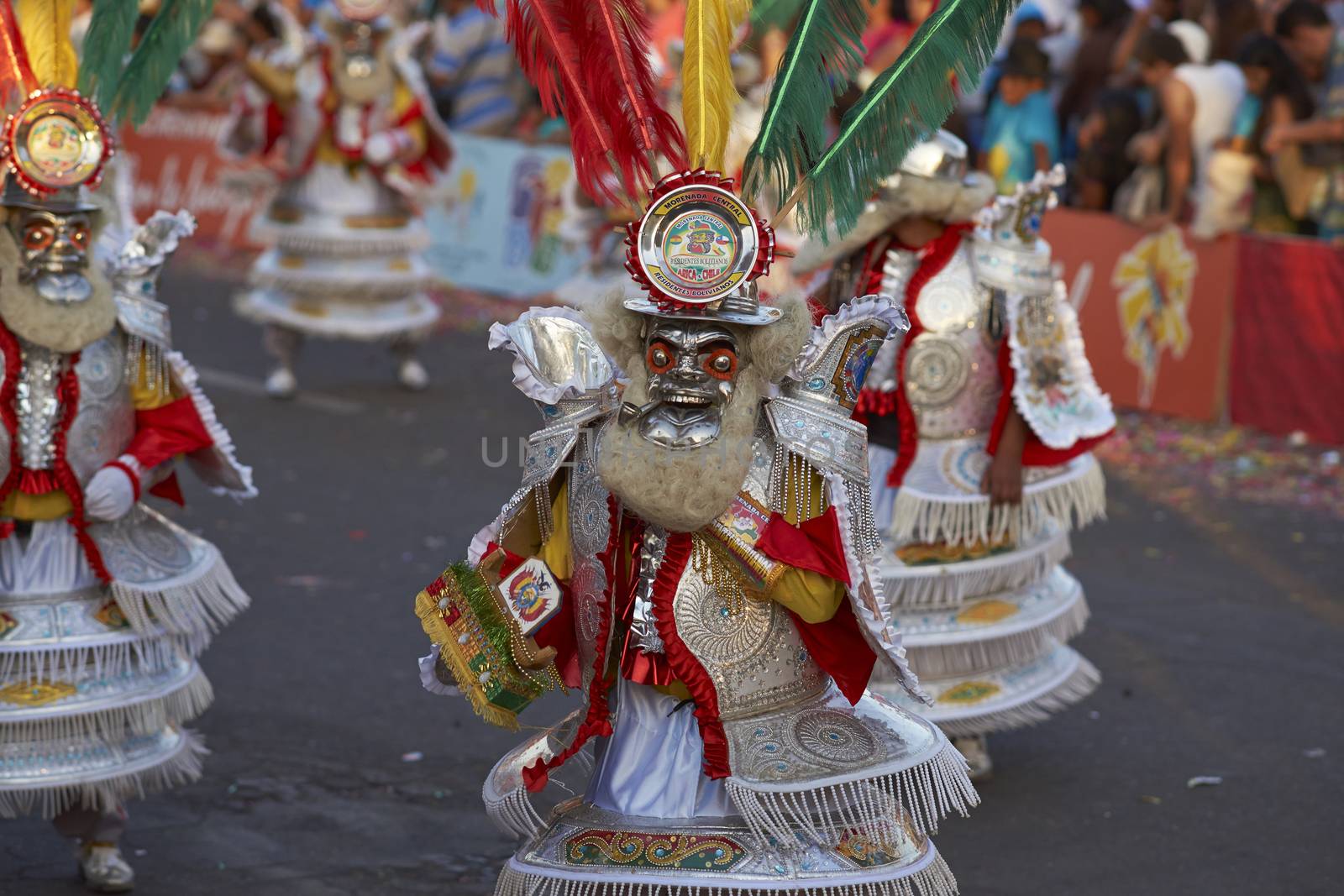 Morenada dance group in traditional Andean costumes performing at the annual Carnaval Andino con la Fuerza del Sol in Arica, Chile.
