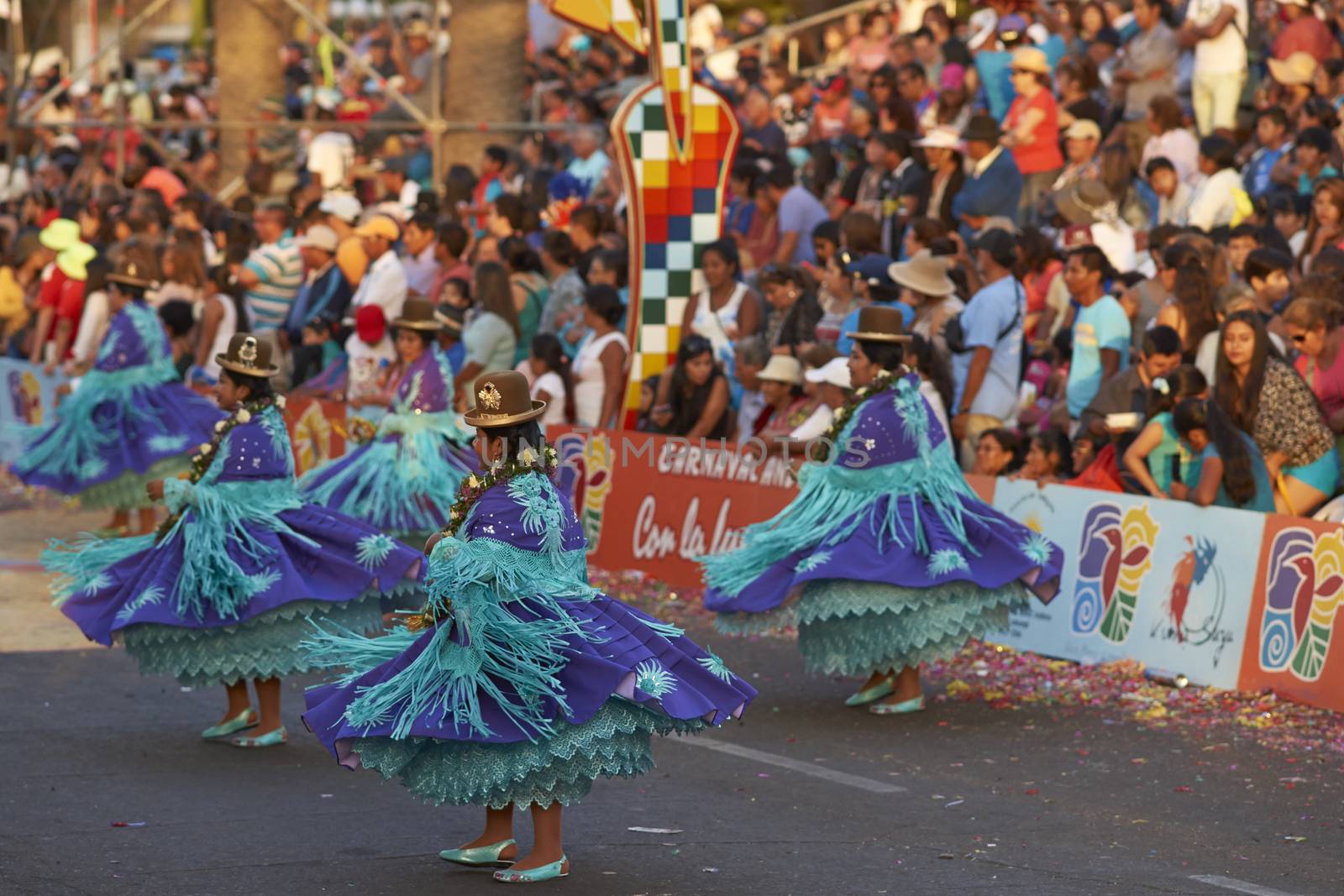 Morenada dance group in traditional Andean costumes performing at the annual Carnaval Andino con la Fuerza del Sol in Arica, Chile.