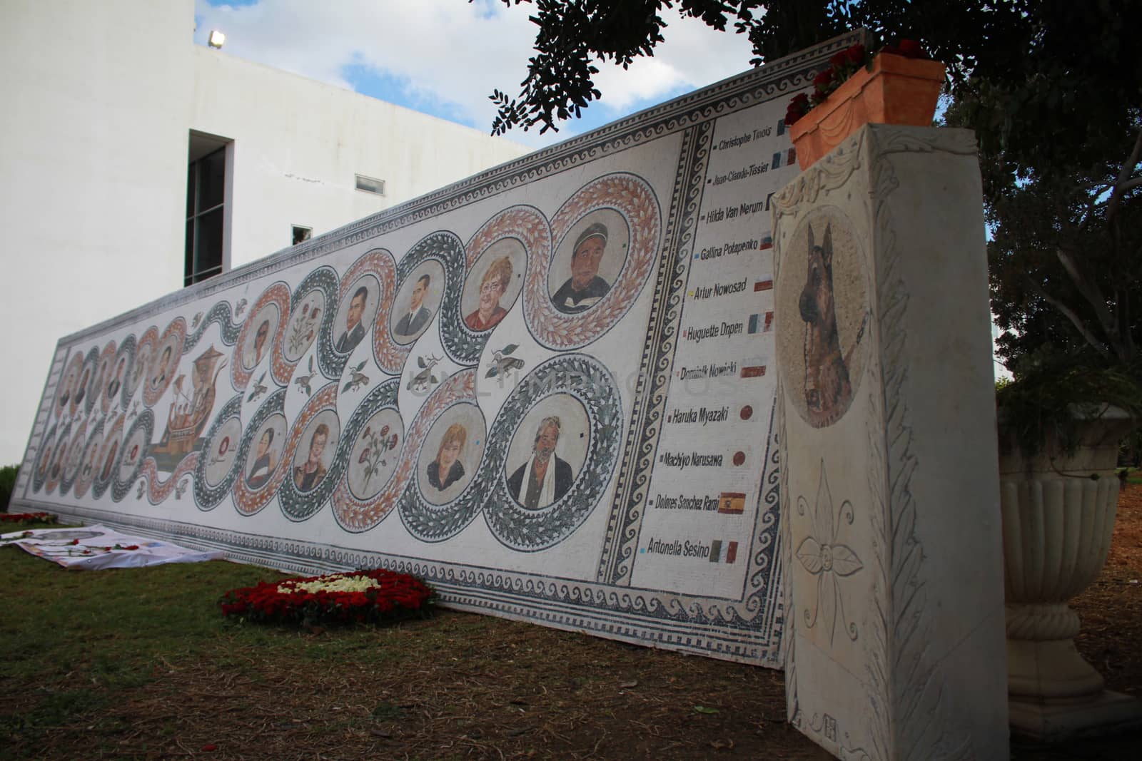TUNISIA, Tunis: A memorial is on display at the Bardo National Museum in Tunis on March 18, 2016, commemorating the one-year anniversary of the terror attack there. The assault by Islamic State militants left 24 people dead that day in 2015. The pictured memorial bears the victims' faces.
