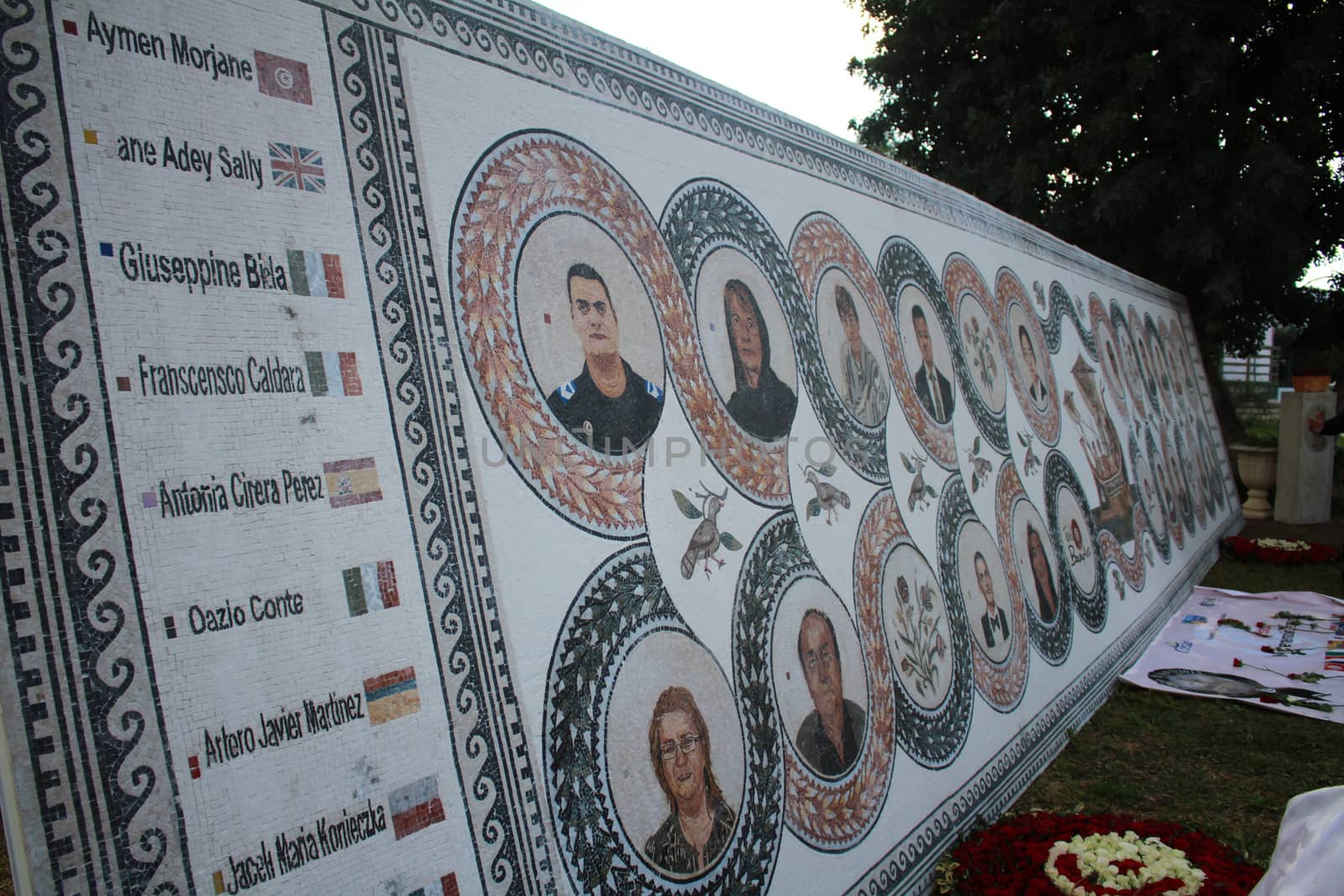 TUNISIA, Tunis: A memorial is on display at the Bardo National Museum in Tunis on March 18, 2016, commemorating the one-year anniversary of the terror attack there. The assault by Islamic State militants left 24 people dead that day in 2015. The pictured memorial bears the victims' faces.