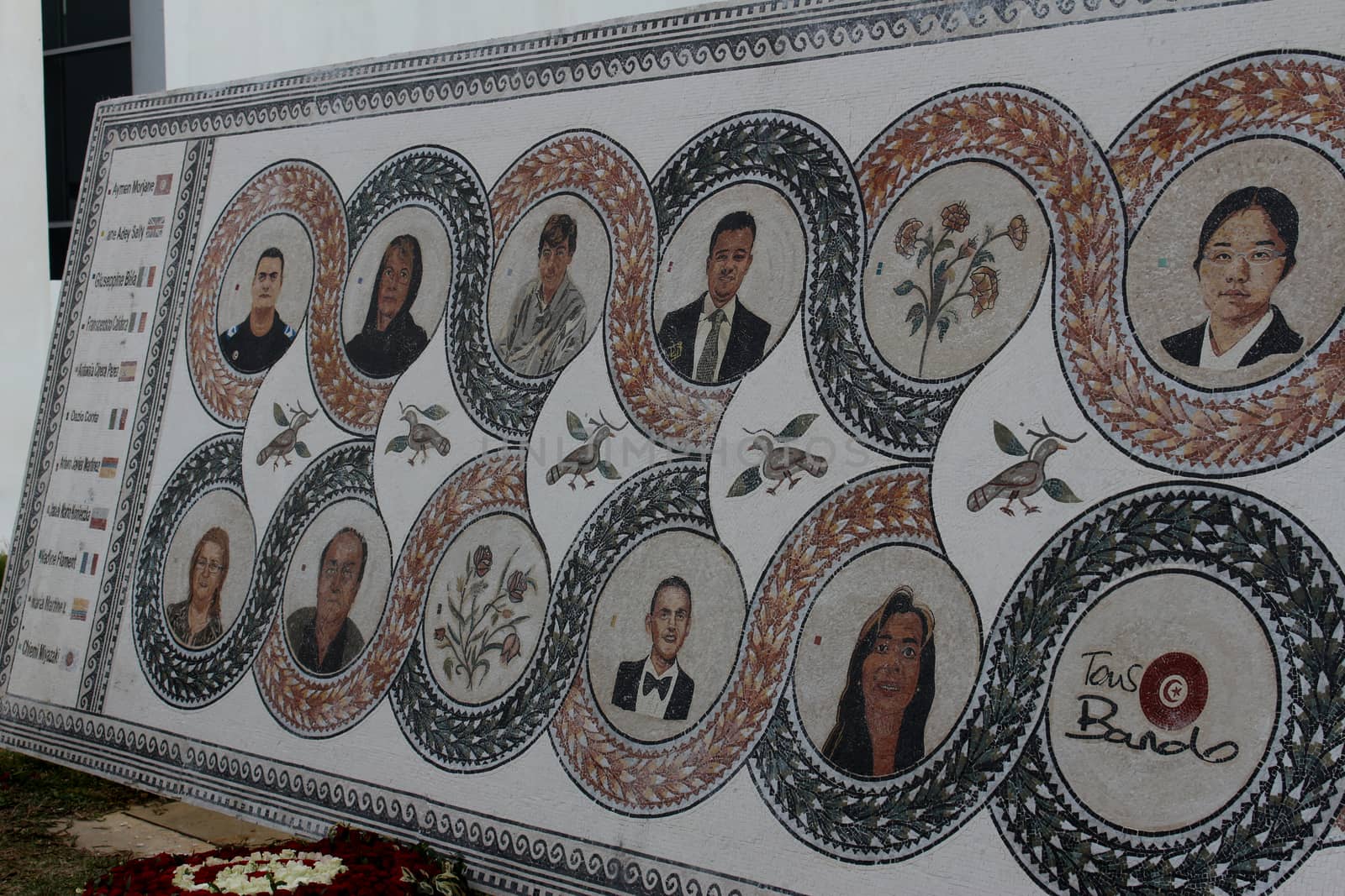 TUNISIA, Tunis: A memorial is on display at the Bardo National Museum in Tunis on March 18, 2016, commemorating the one-year anniversary of the terror attack there. The assault by Islamic State militants left 24 people dead that day in 2015. The pictured memorial bears the victims' faces. 