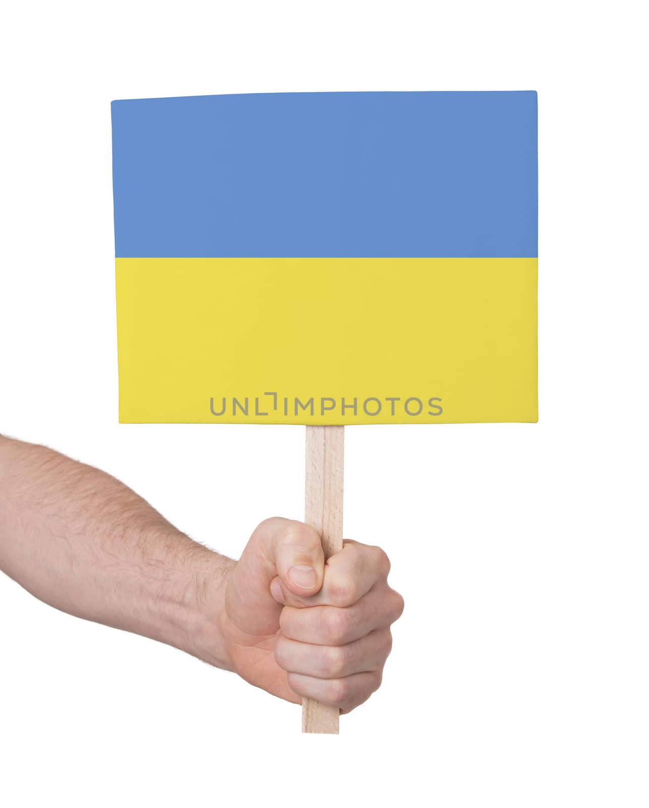 Hand holding small card, isolated on white - Flag of Ukraine