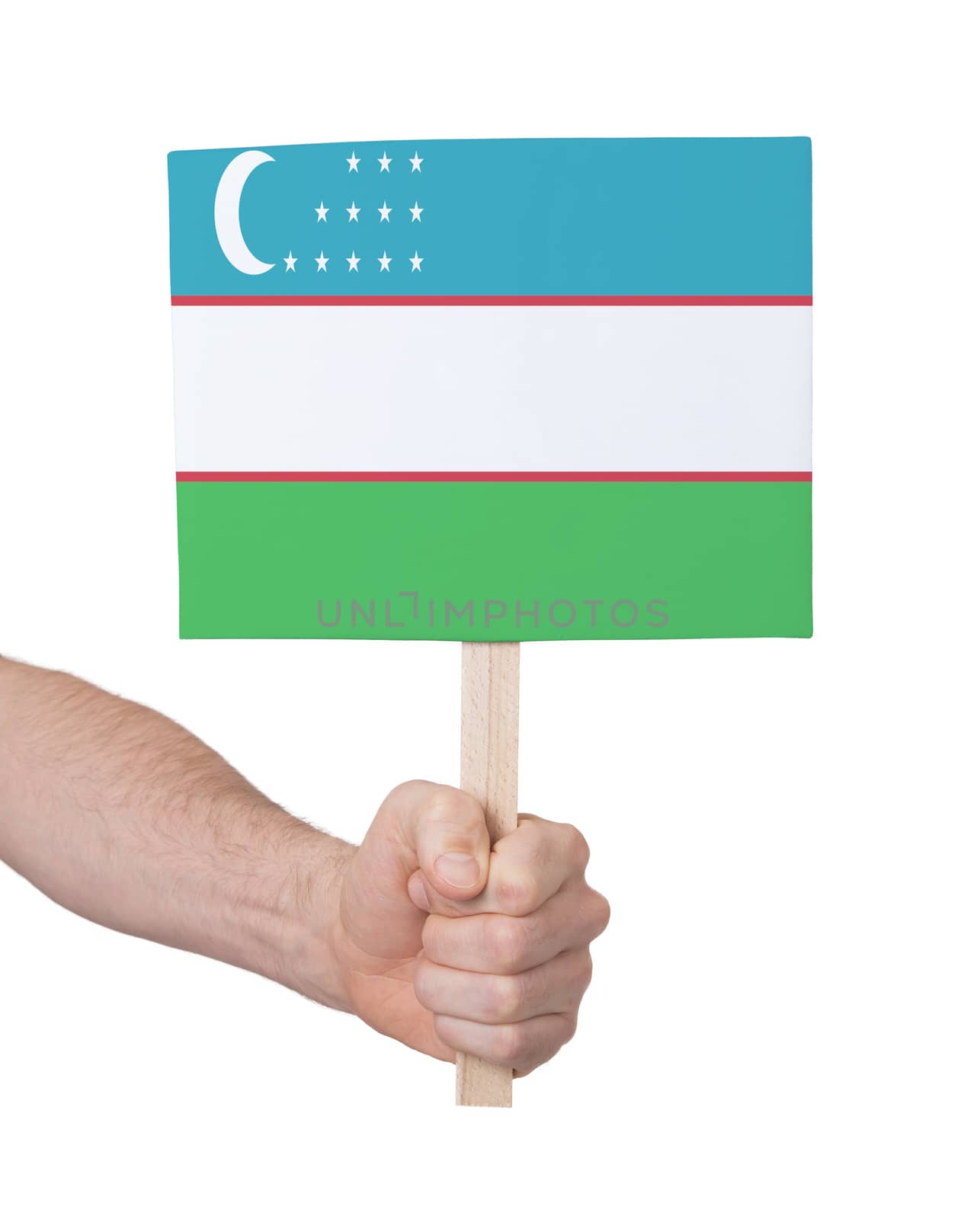 Hand holding small card - Flag of Uzbekistan by michaklootwijk