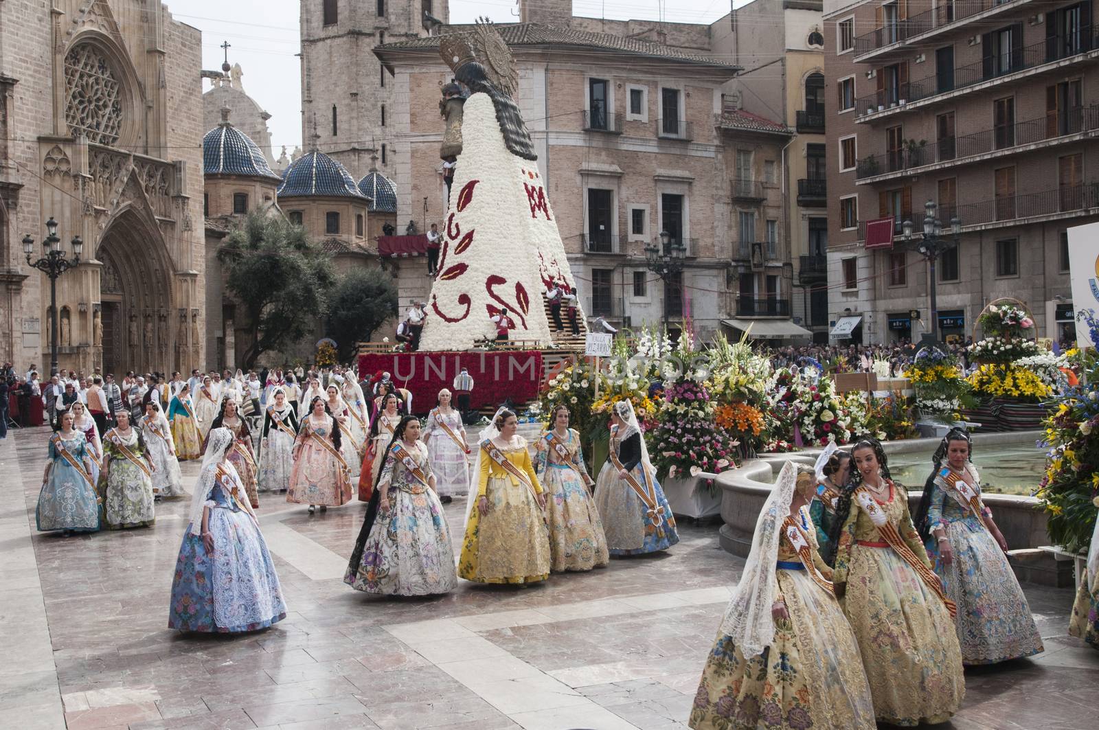 SPAIN, Valencia: Members of different fallas associations (Casales Falleros) march in the streets in Valencia, Spain, on March 18, 2016, to take part in the offering of flowers to the disadvantaged Virgin, as part of the Fallas festival. Fallas are gigantic structures made of cardboard portraying current events and personalities in which individual figures. 