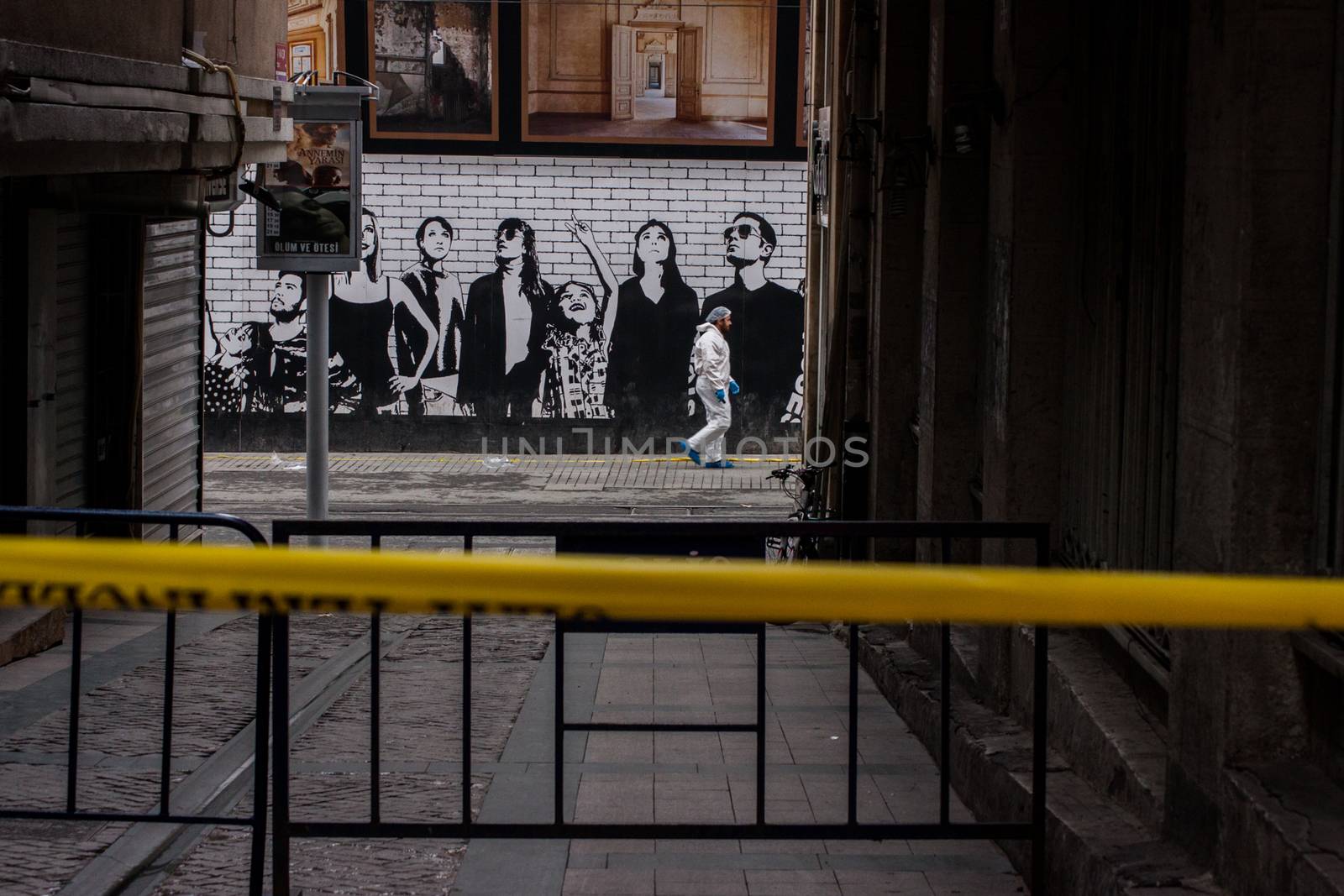 TURKEY, Istanbul: Police secure the area following a suicide bombing in a major shopping and tourist district at Istiklal street in the central part of the city on March 19, 2016 in Istanbul, Turkey. The explosion killed at least five people and left many injured.