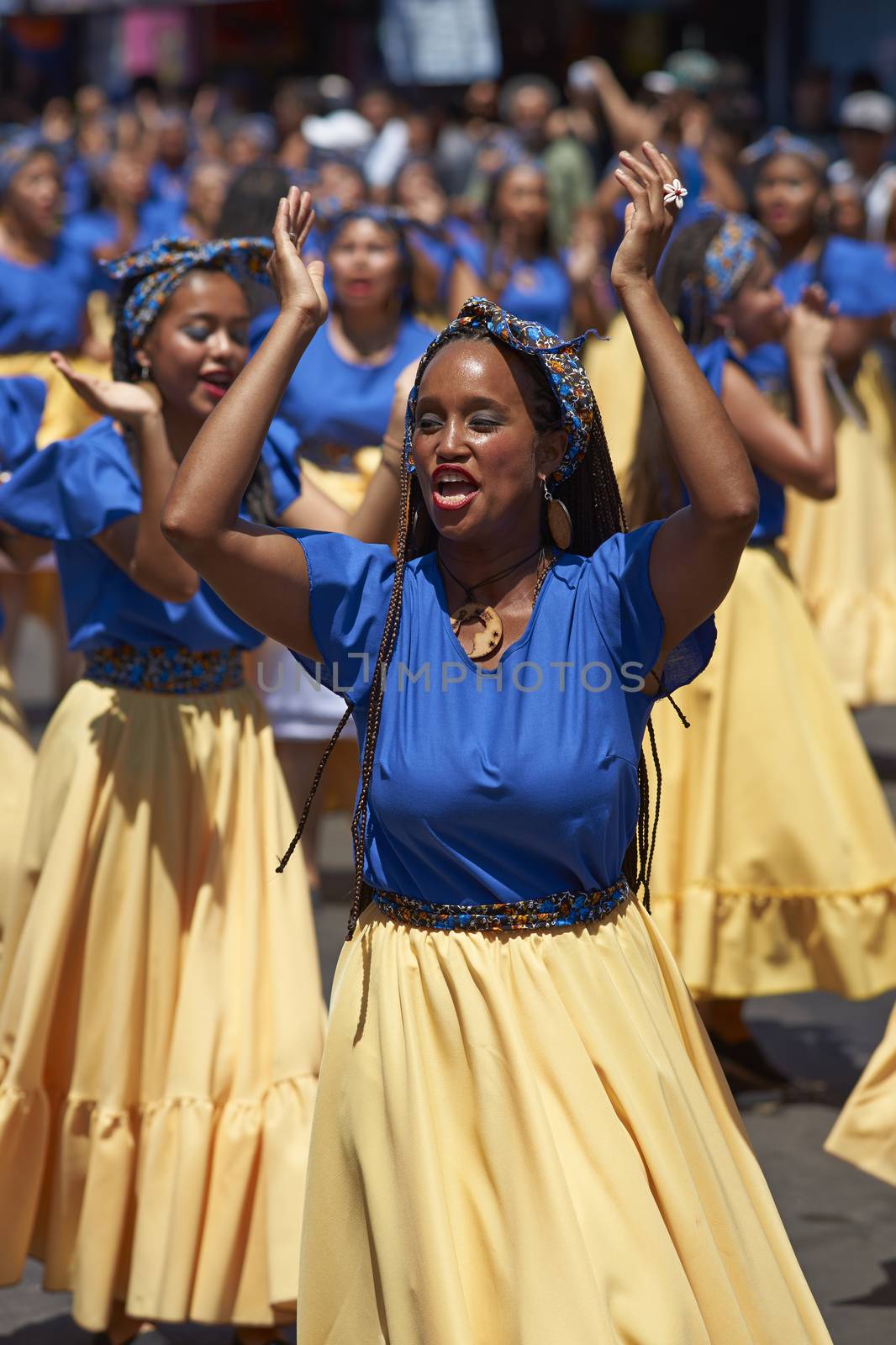 Group of dancers of Africa descent (Afrodescendiente) performing at the annual Carnaval Andino con la Fuerza del Sol in Arica, Chile.