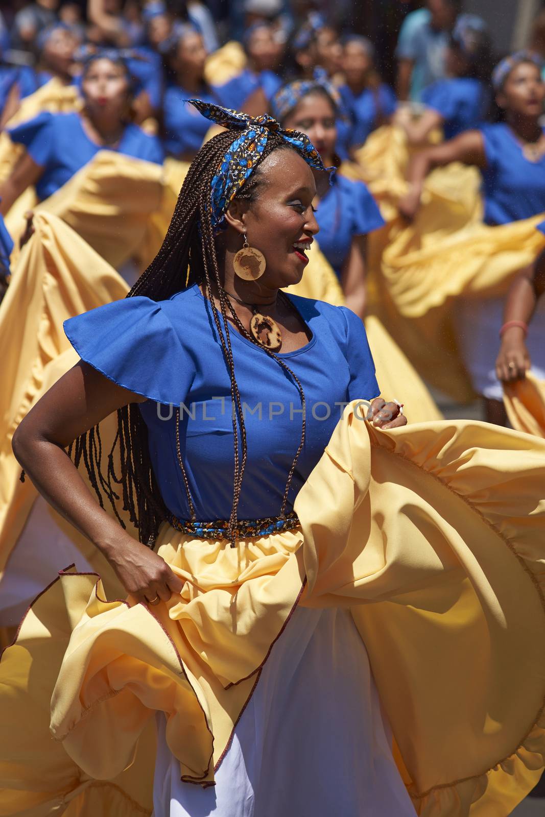 Group of dancers of Africa descent (Afrodescendiente) performing at the annual Carnaval Andino con la Fuerza del Sol in Arica, Chile.