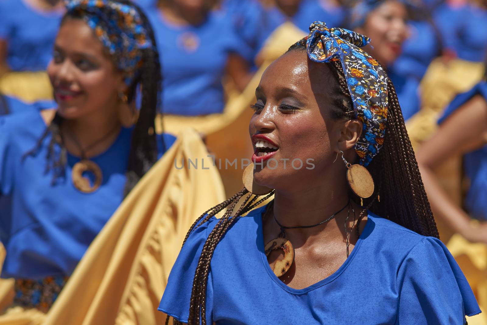 Group of dancers of Africa descent (Afrodescendiente) performing at the annual Carnaval Andino con la Fuerza del Sol in Arica, Chile.