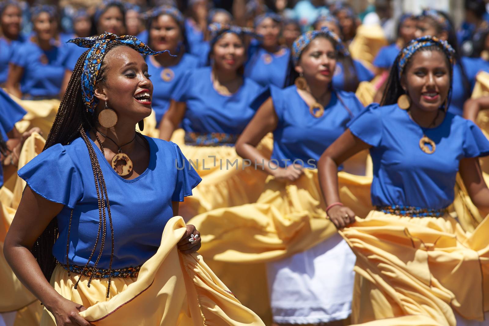 Group of dancers of Africa descent (Afrodescendiente) performing at the annual Carnaval Andino con la Fuerza del Sol in Arica, Chile.