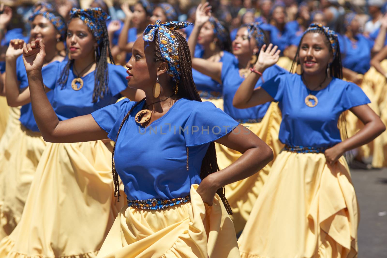 Group of dancers of Africa descent (Afrodescendiente) performing at the annual Carnaval Andino con la Fuerza del Sol in Arica, Chile.
