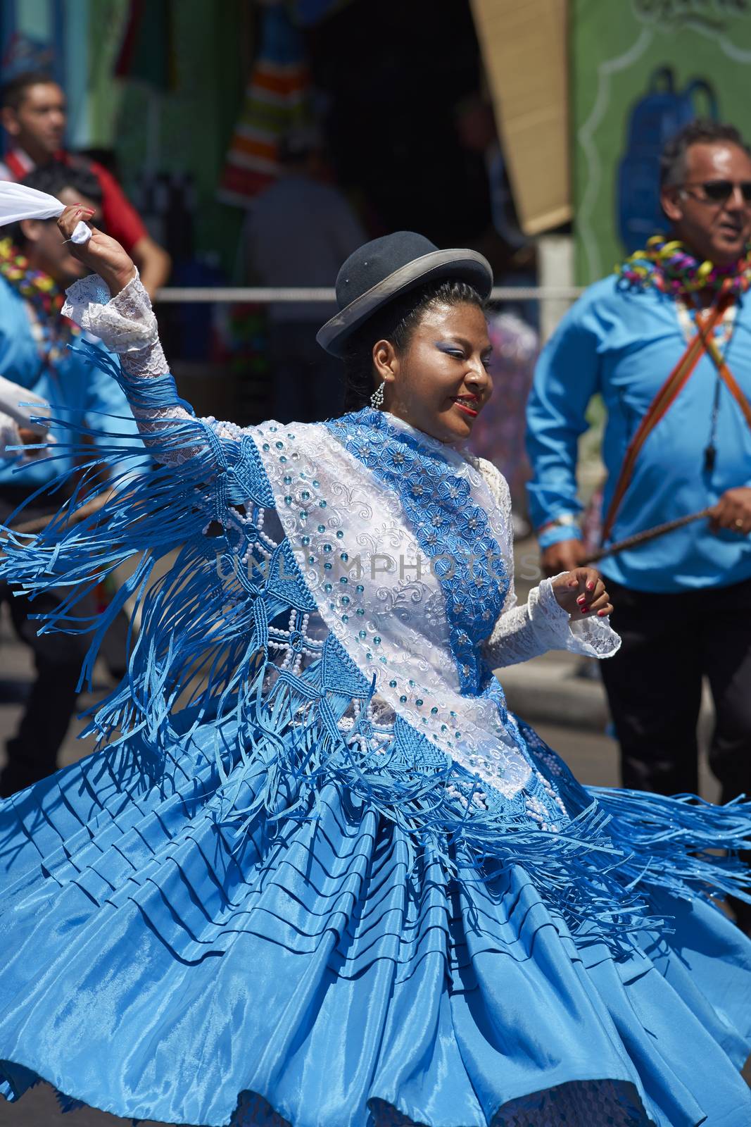 Female dancer in a Morenada dance group performing a traditional ritual dance as part of the Carnaval Andino con la Fuerza del Sol in Arica, Chile.