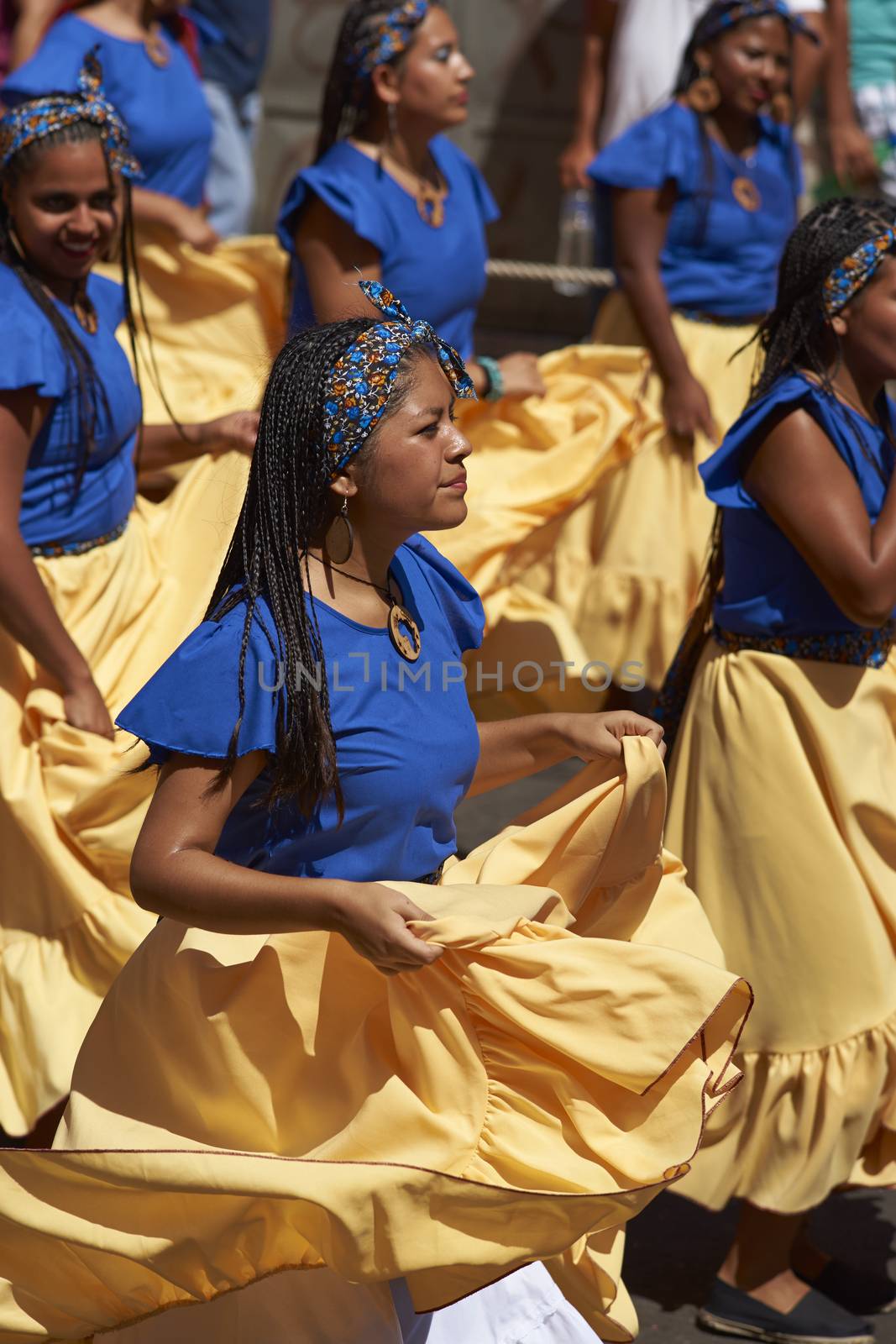 Group of dancers of Africa descent (Afrodescendiente) performing at the annual Carnaval Andino con la Fuerza del Sol in Arica, Chile.