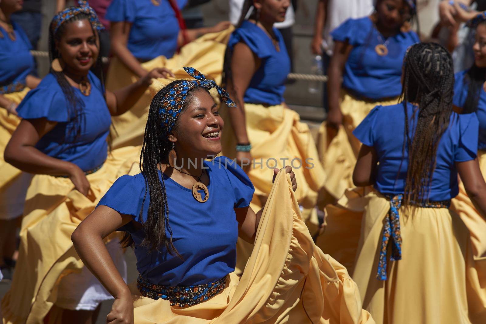 Group of dancers of Africa descent (Afrodescendiente) performing at the annual Carnaval Andino con la Fuerza del Sol in Arica, Chile.