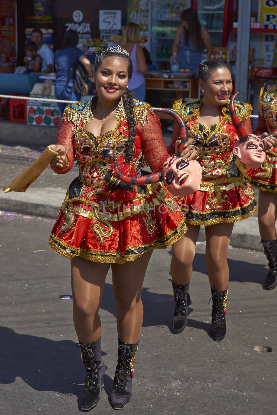 Young women performing the Diablada (dance of the devil) as part of the Carnaval Andino con la Fuerza del Sol in Arica, Chile. The dance originates in Oruro, Bolivia.