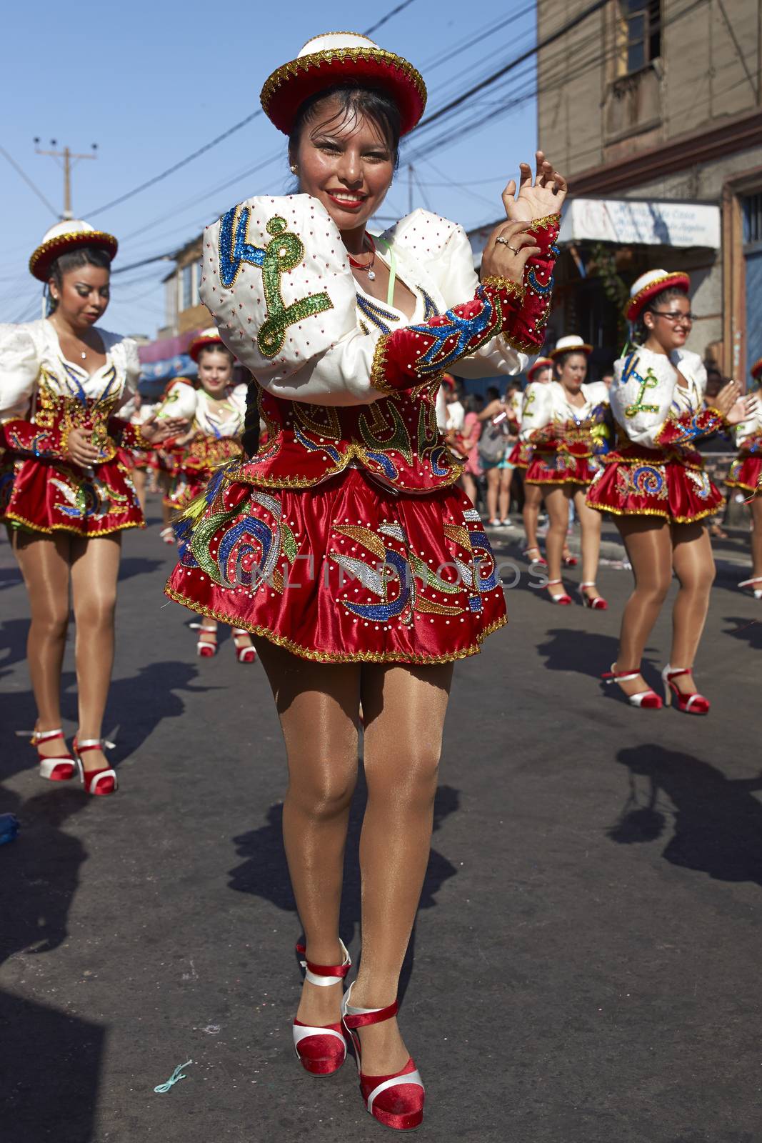 Caporales dancers in ornate costumes performing at the annual Carnaval Andino con la Fuerza del Sol in Arica, Chile.