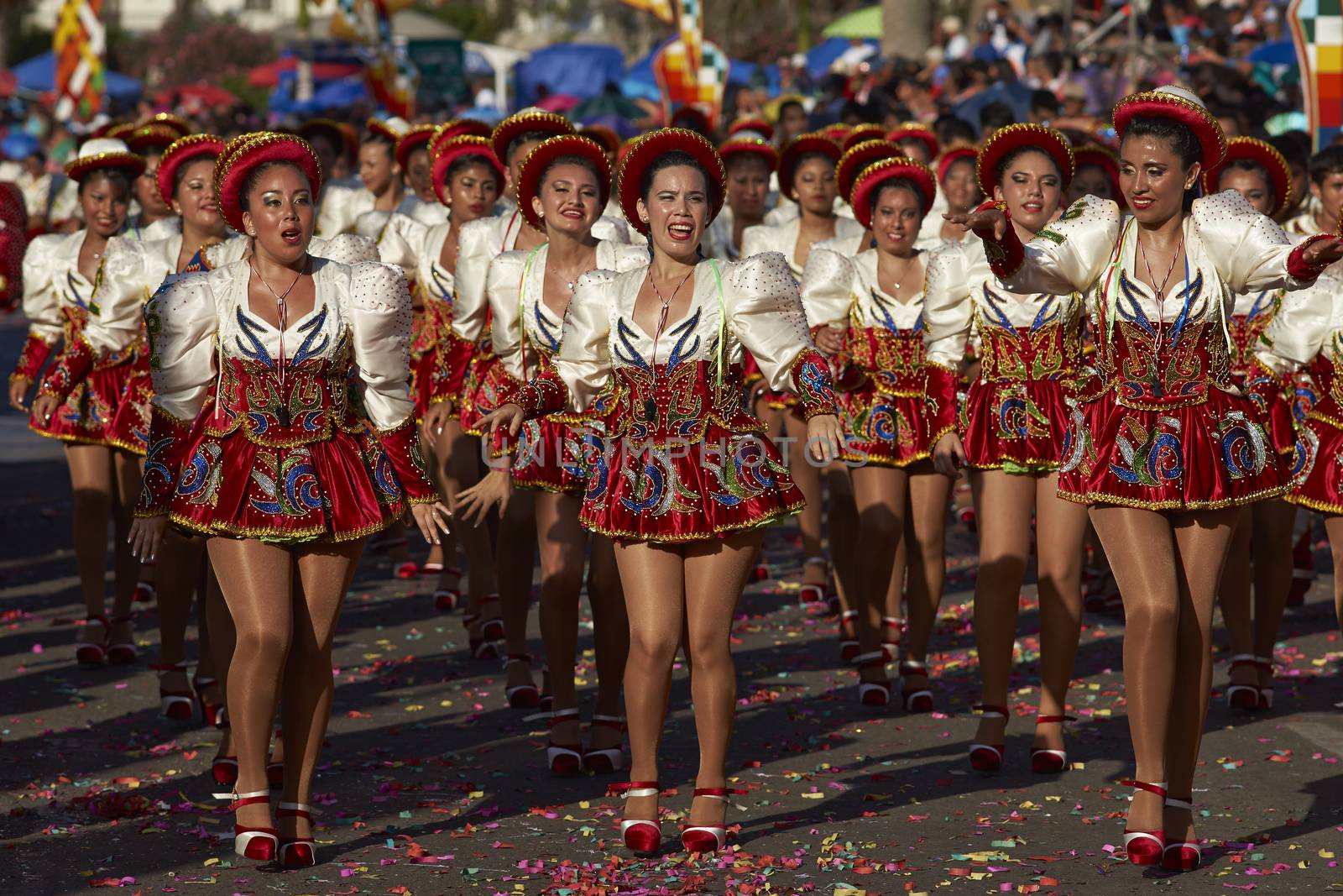 Caporales dancers in ornate costumes performing at the annual Carnaval Andino con la Fuerza del Sol in Arica, Chile.