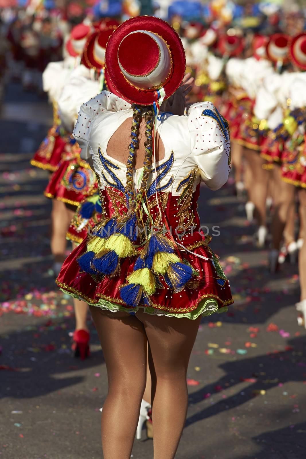 Caporales dancers in ornate costumes performing at the annual Carnaval Andino con la Fuerza del Sol in Arica, Chile.