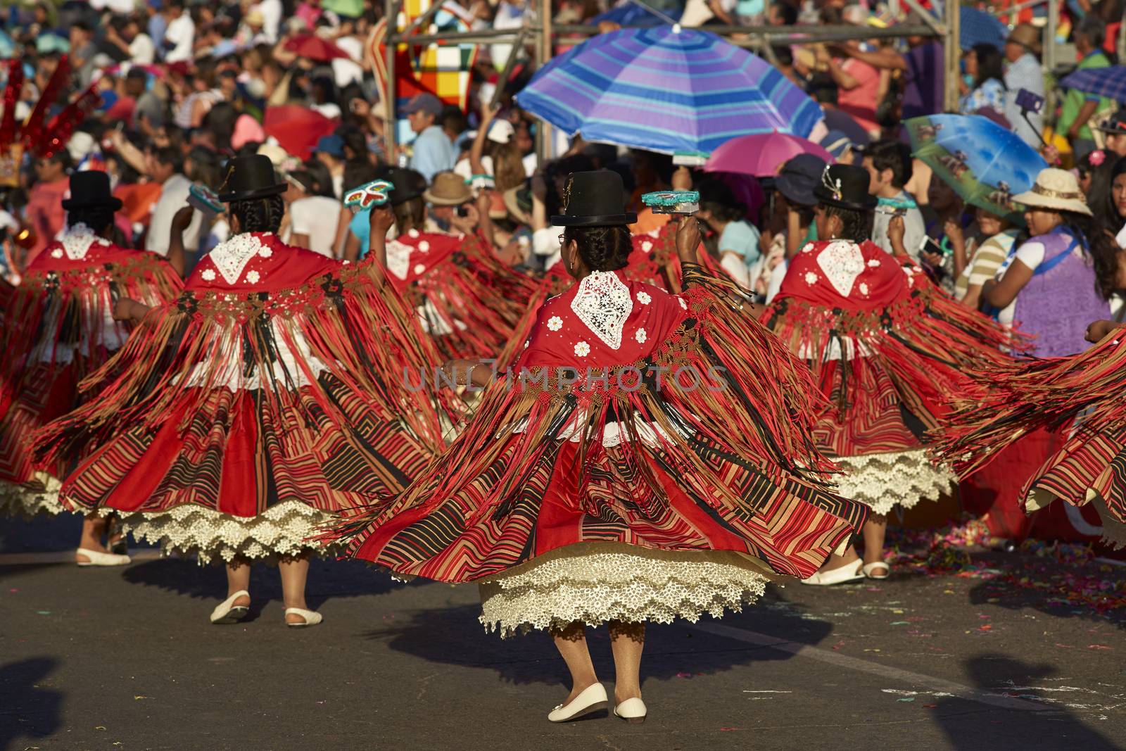 Morenada dancers in traditional Andean costume performing at the annual Carnaval Andino con la Fuerza del Sol in Arica, Chile.