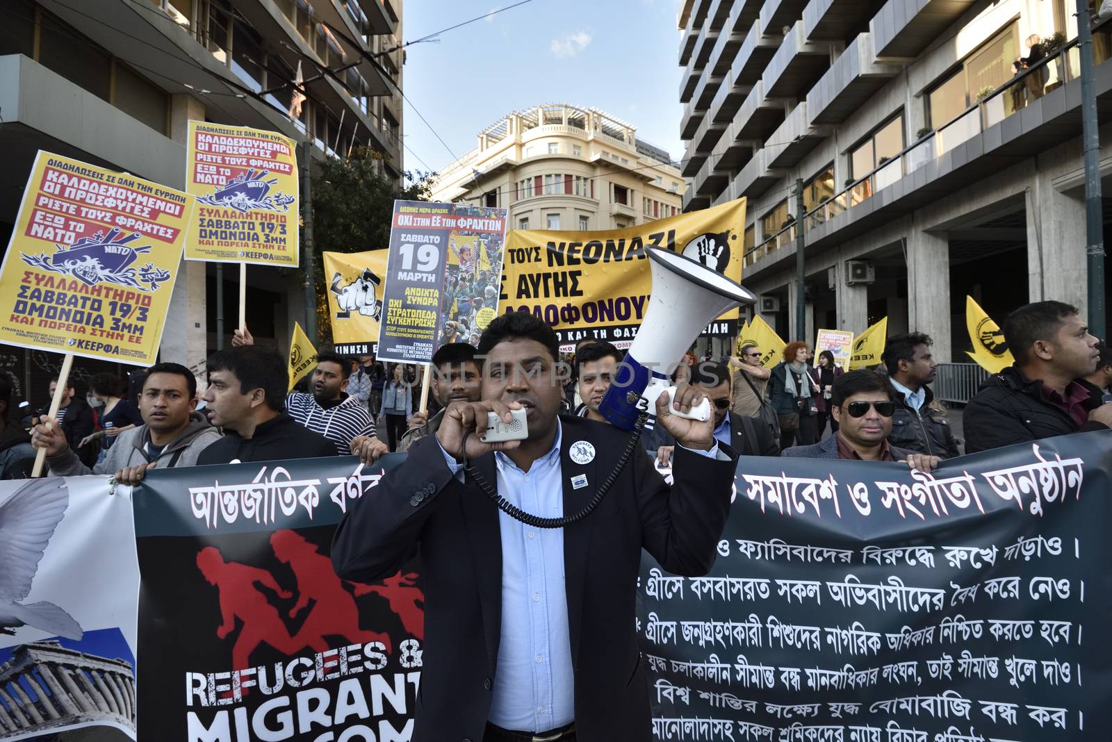GREECE, Athens: Migrants march in central Athens holding banners and shouting slogans on March 19, 2016.Hundreds of migrants and supporters took part in a protest march in central Athens, condemning border fences and the NATO involvement in the refugee crisis. The protesters are calling for open borders to help the influx of migrants who are struggling in camps.
